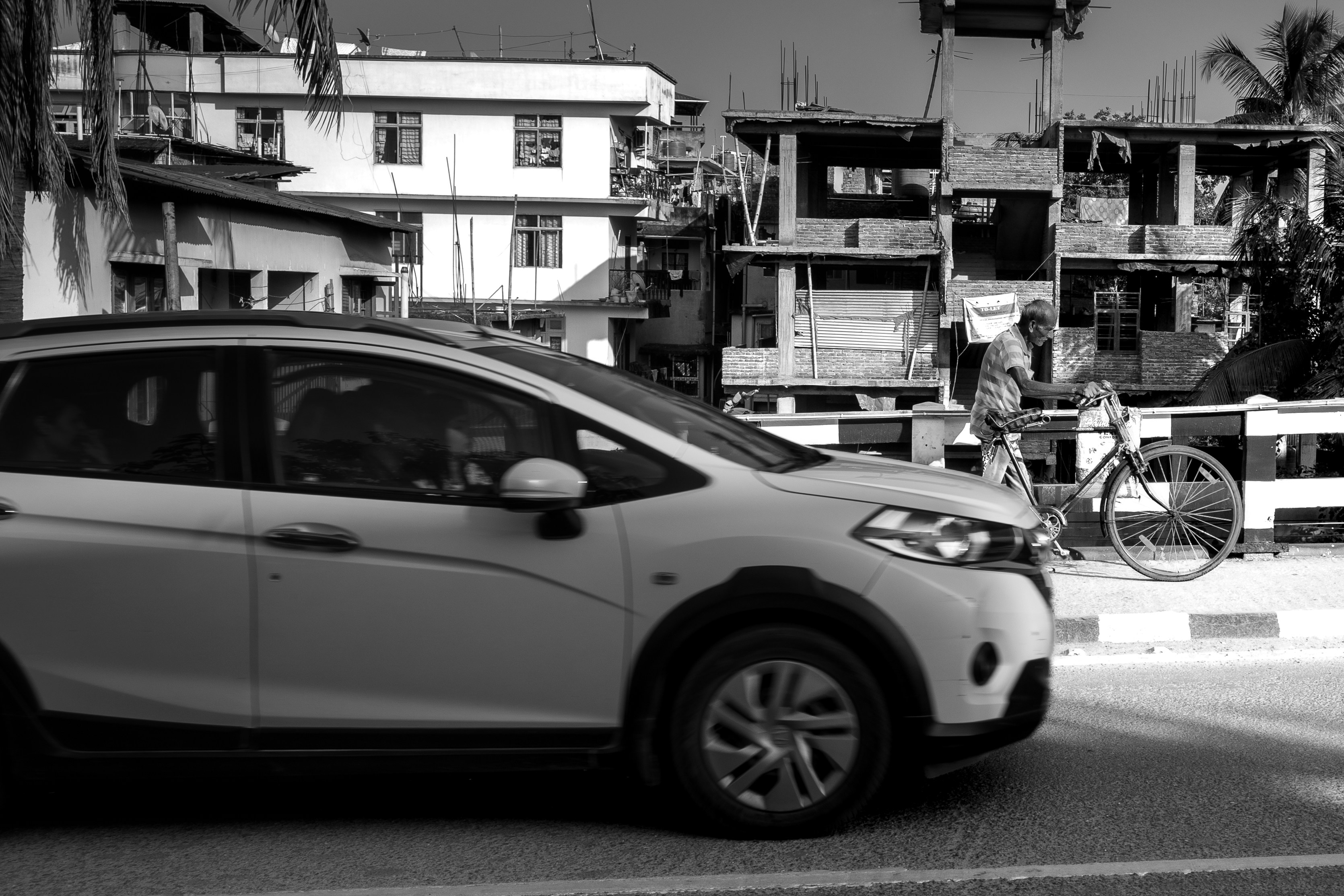 Family driving a modern electric SUV through a suburban neighborhood