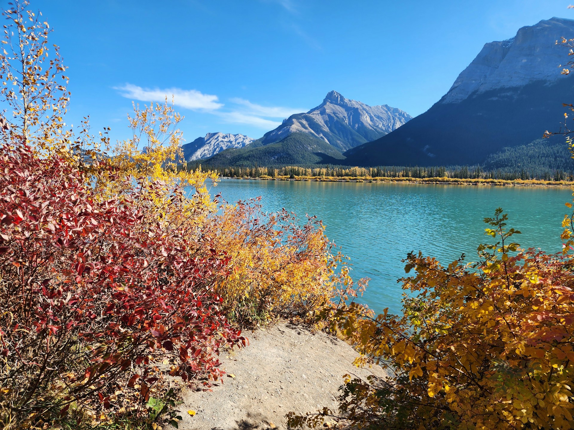 A scenic view of a lake with mountains in the background