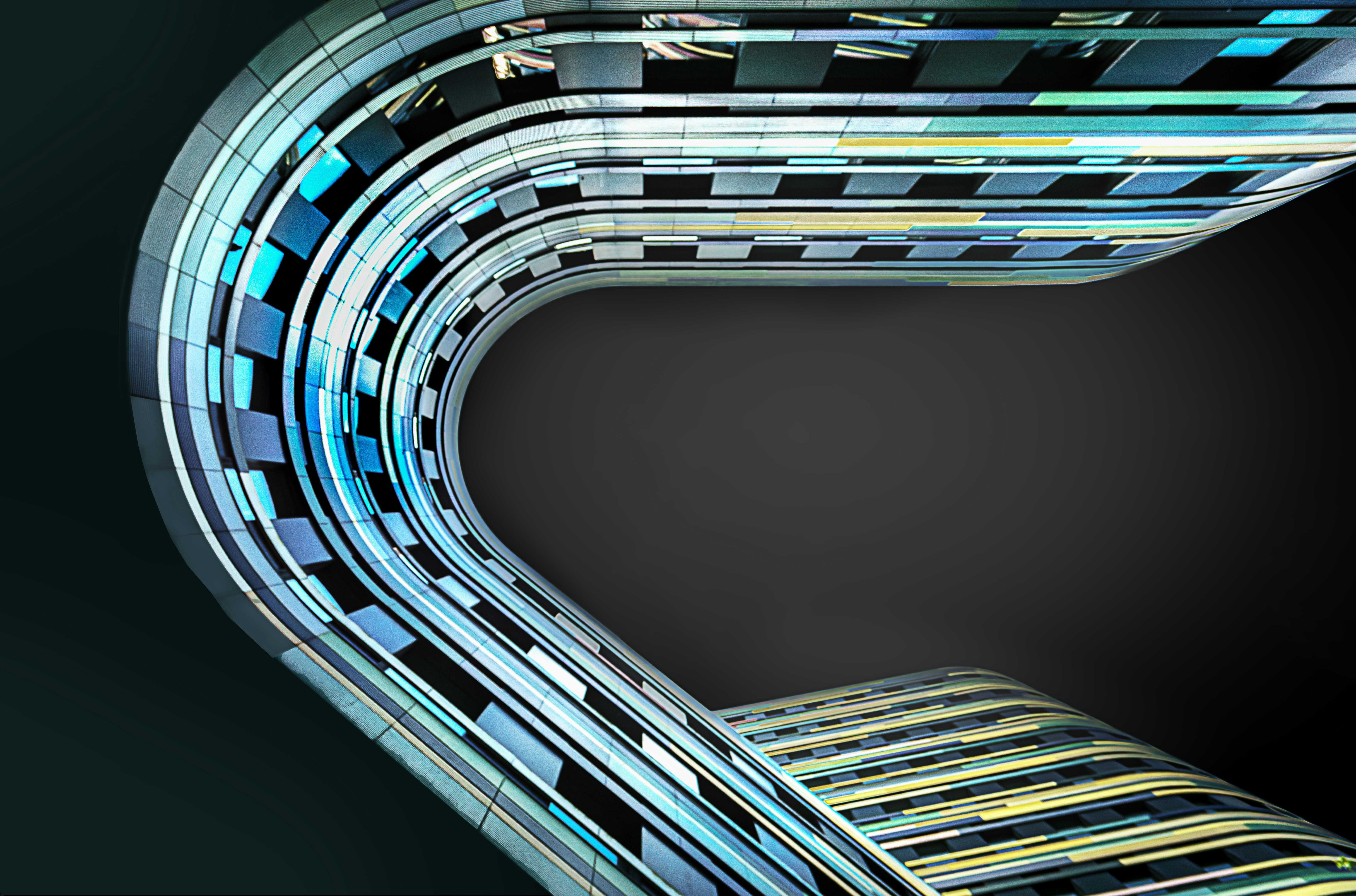 A curved metal object on a black background