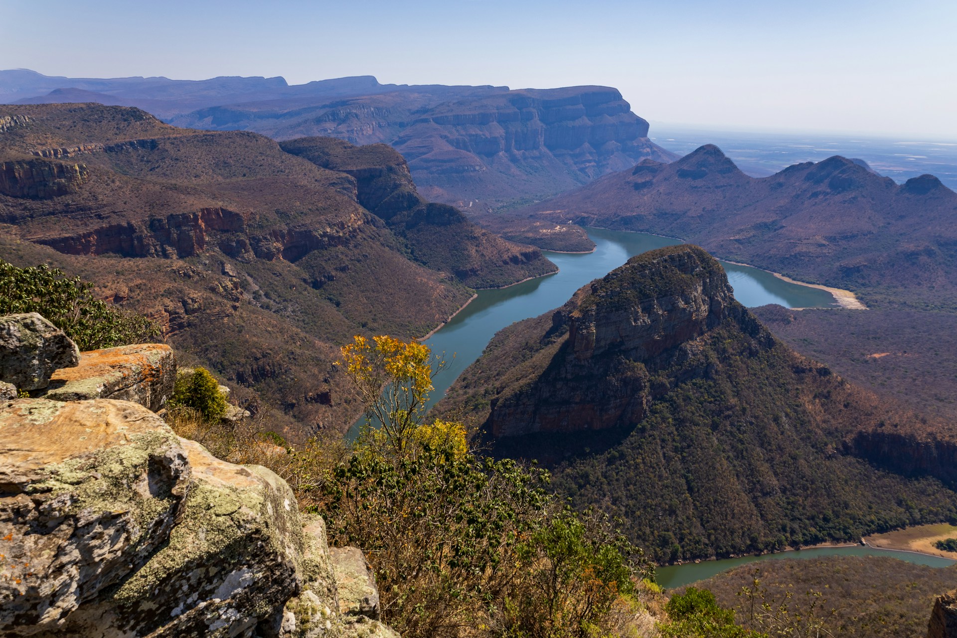 A view of a mountain range with a lake in the middle