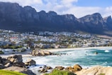 A view of a beach with mountains in the background