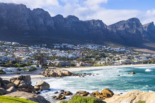 A view of a beach with mountains in the background