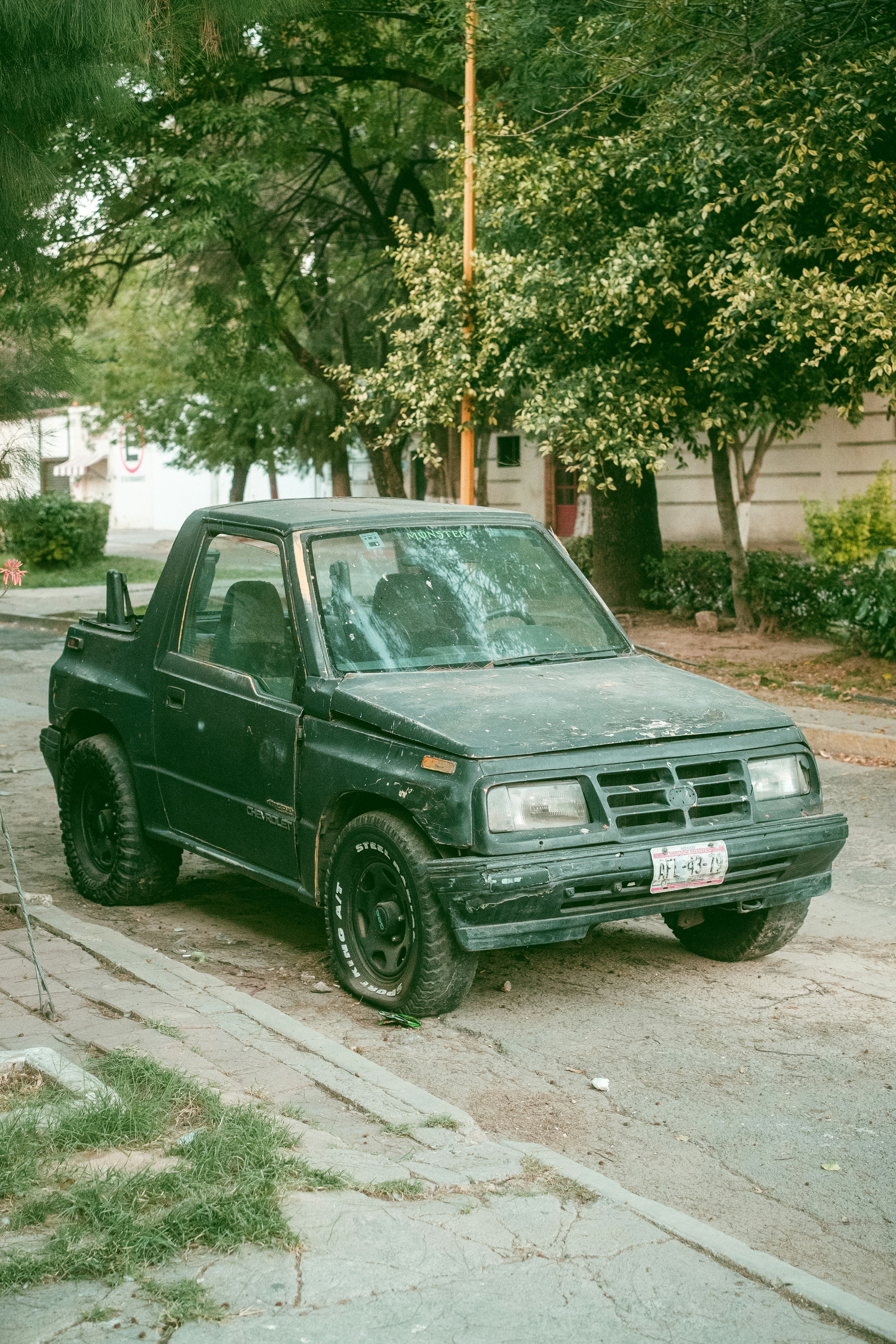 A truck parked on the side of the road