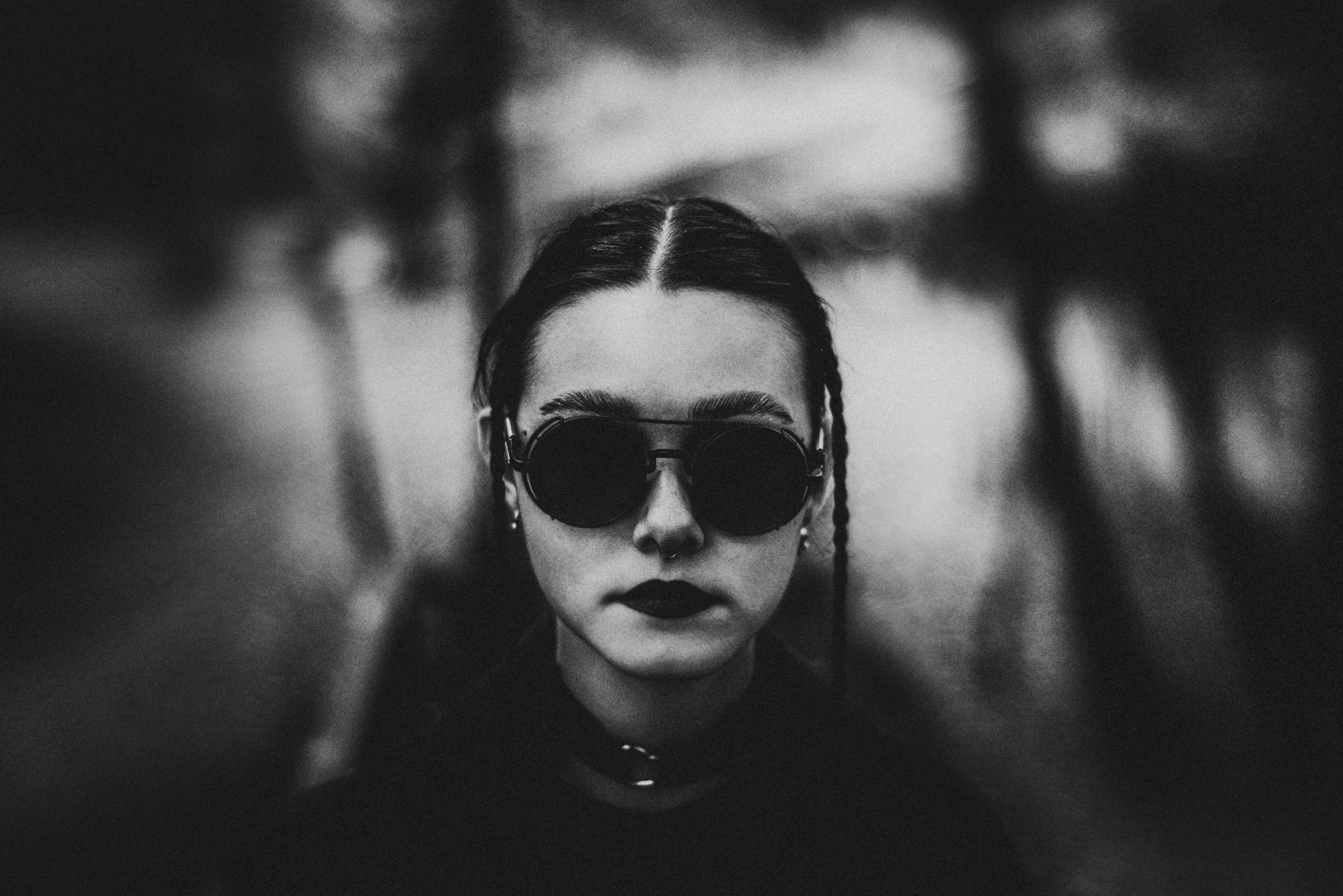 A woman wearing sunglasses and a black shirt