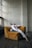 A person laying on a couch in a room
