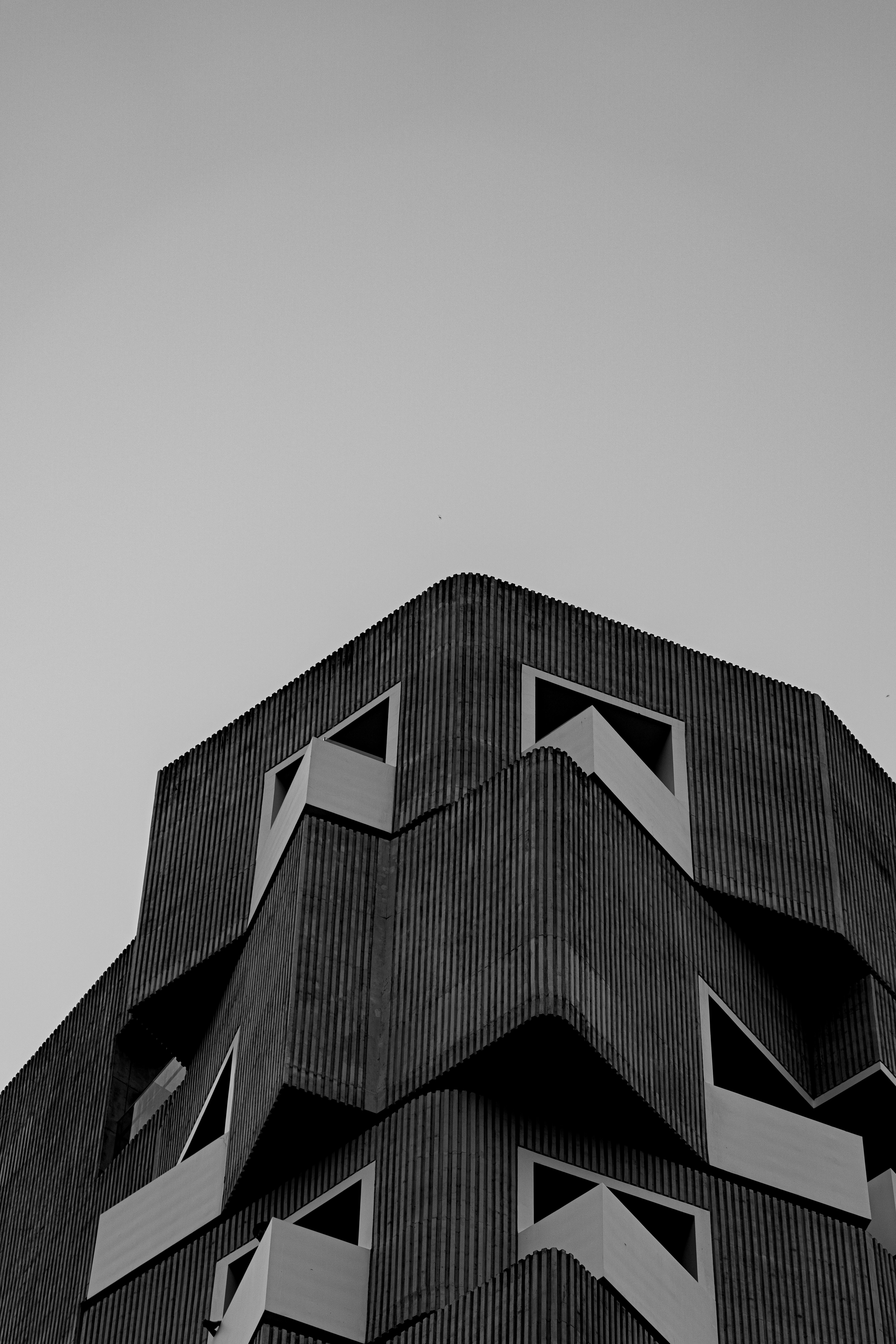 A black and white photo of a tall building