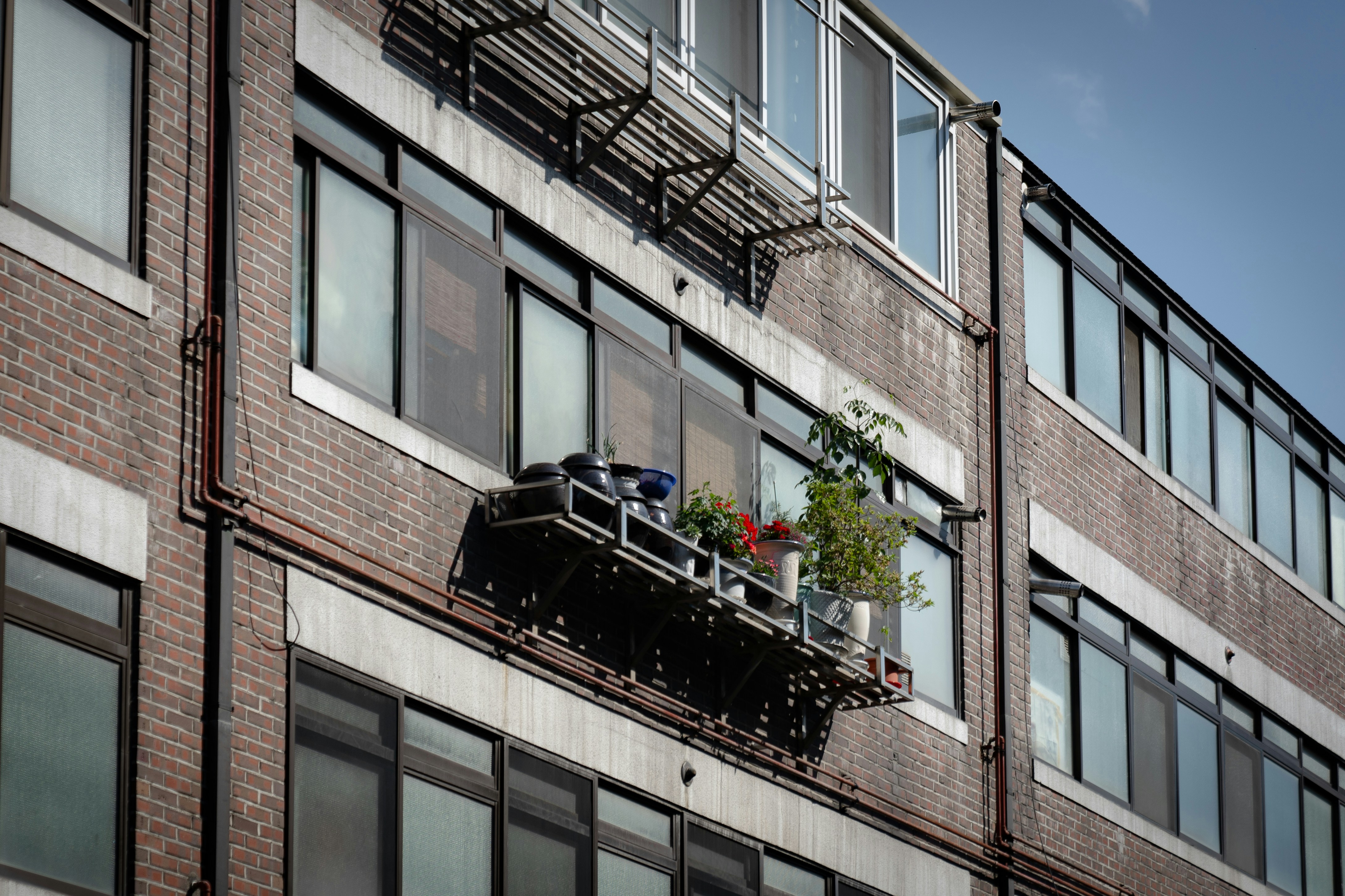 A tall brick building with lots of windows