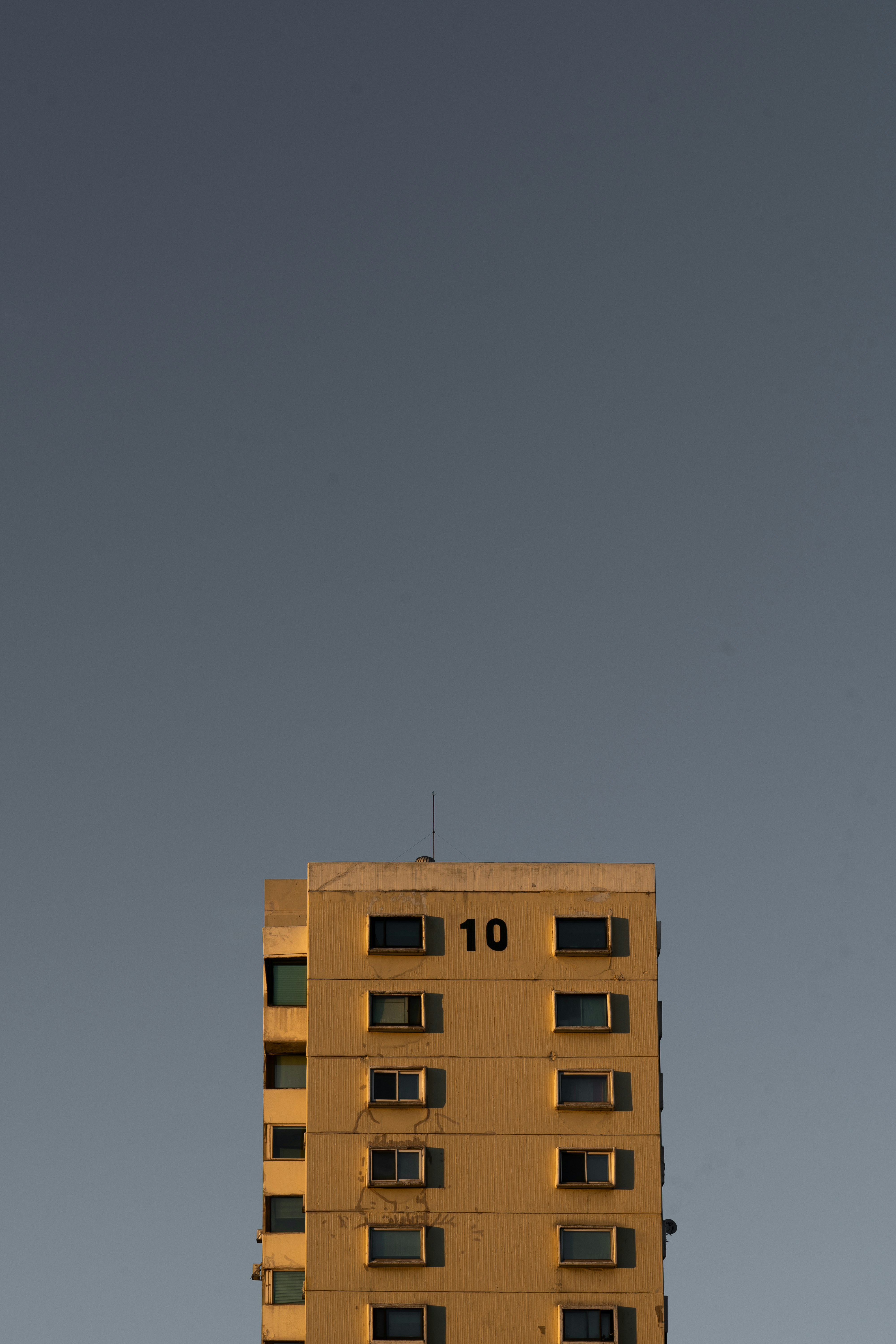 A tall building with a clock on the top of it