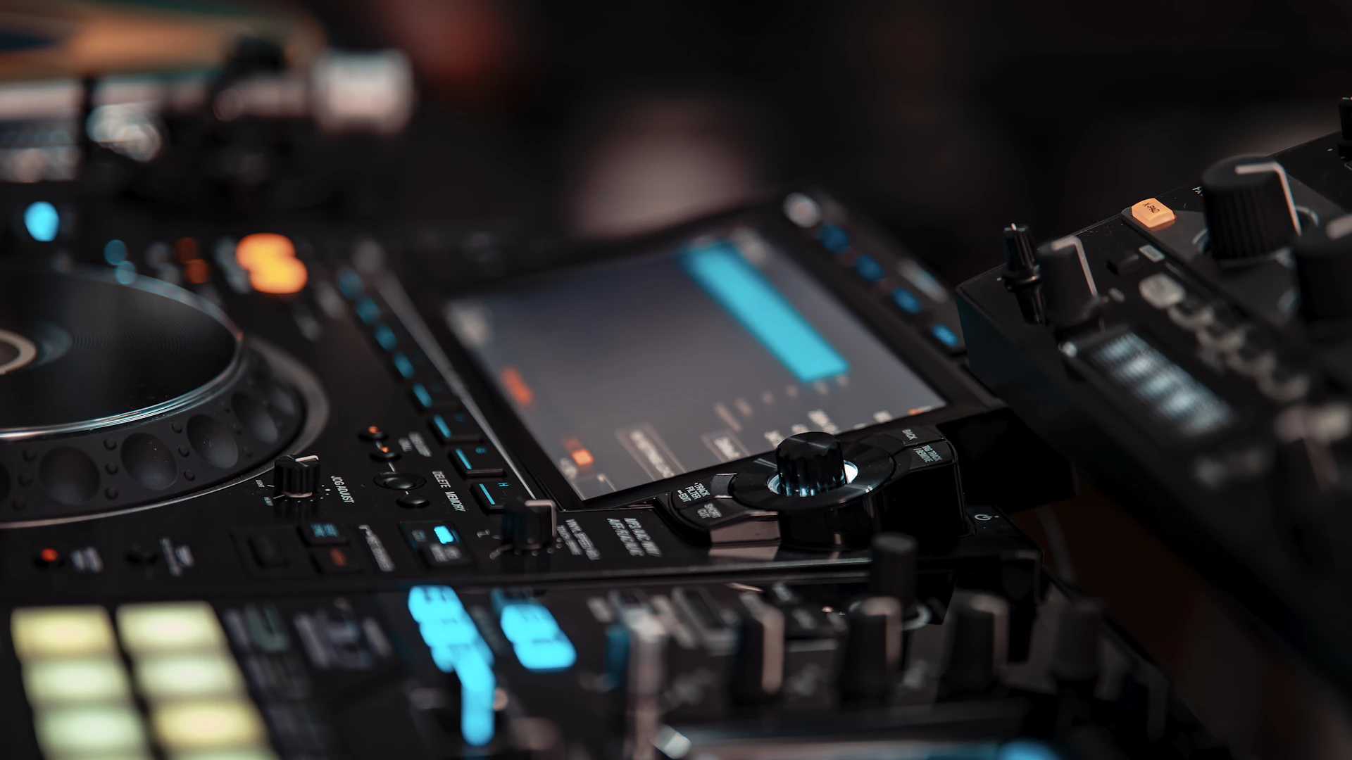 A close up of a dj mixing equipment