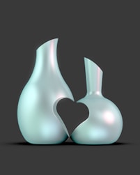 A couple of vases sitting next to each other