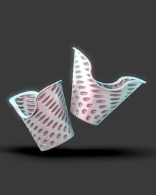 A couple of white objects that are on a black surface