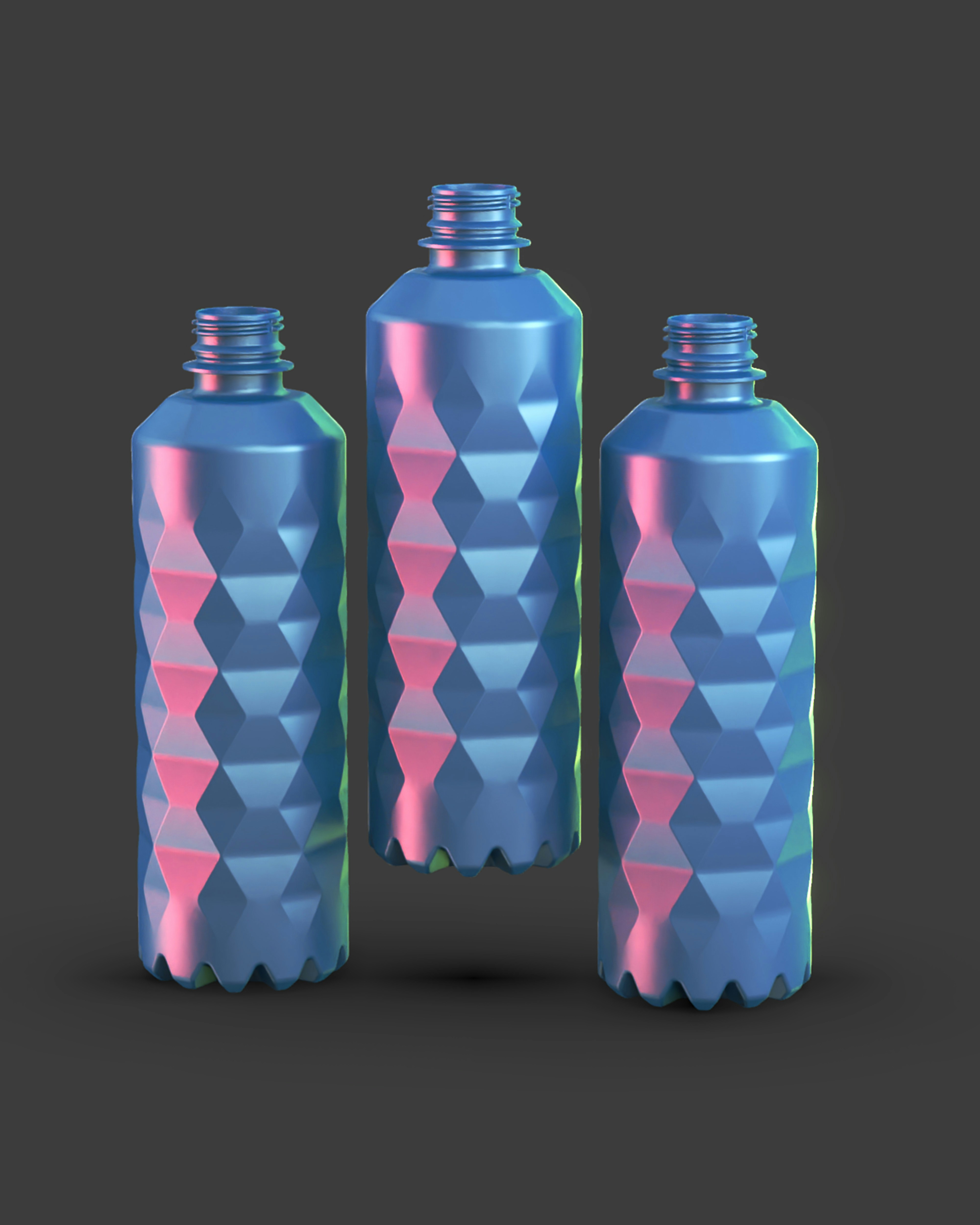 Three blue and pink plastic bottles on a gray background