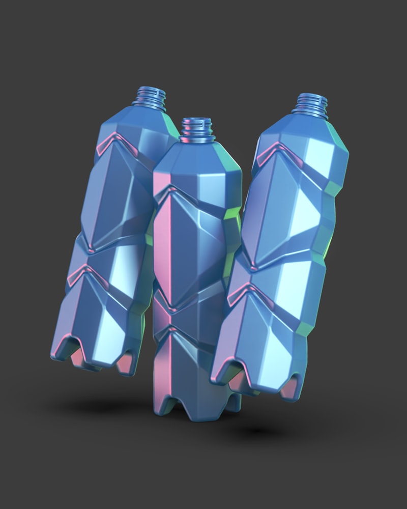 A couple of custom-shape blue bottles sitting next to each other