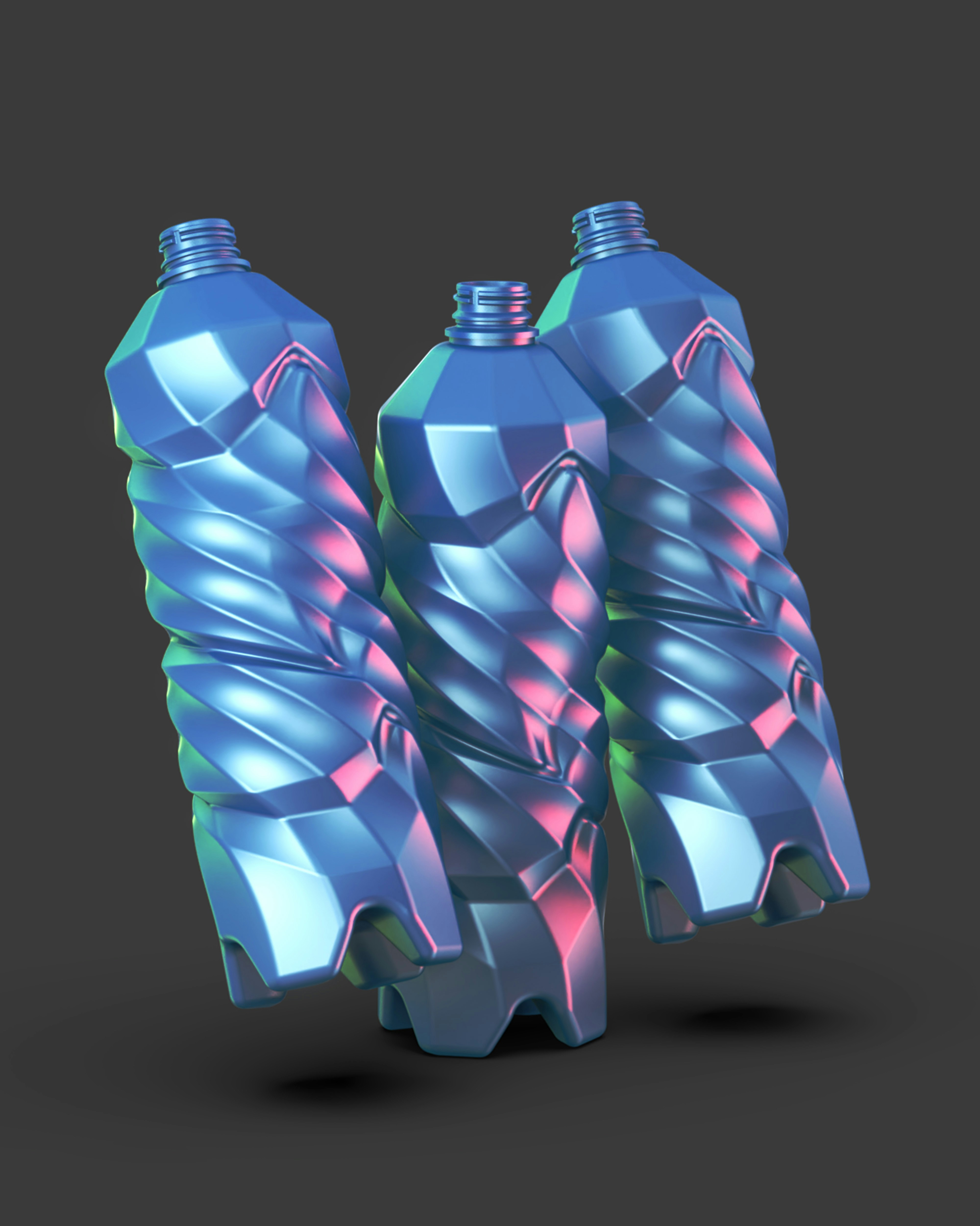 Two blue and pink plastic bottles on a black background
