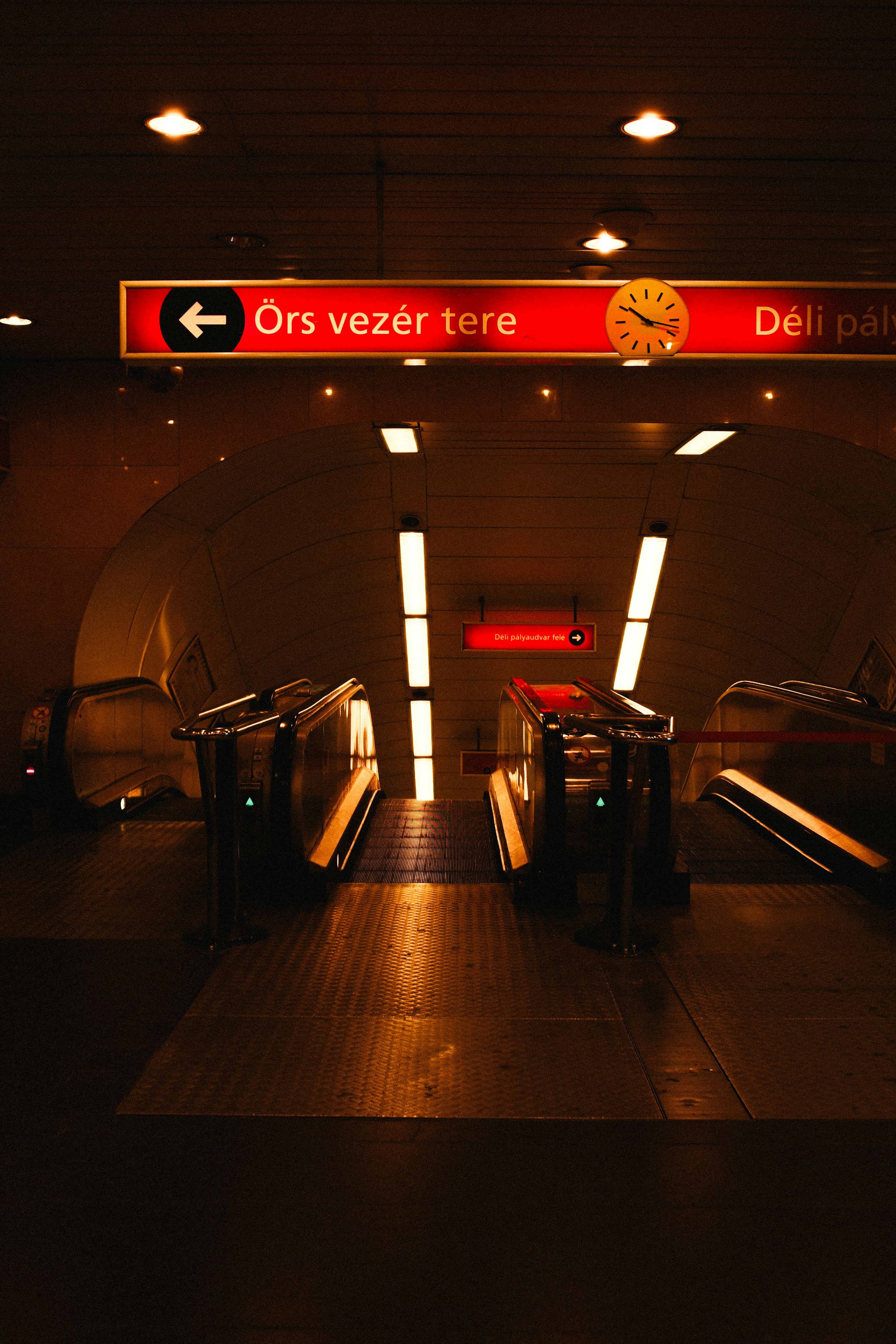 An escalator in a subway station at night