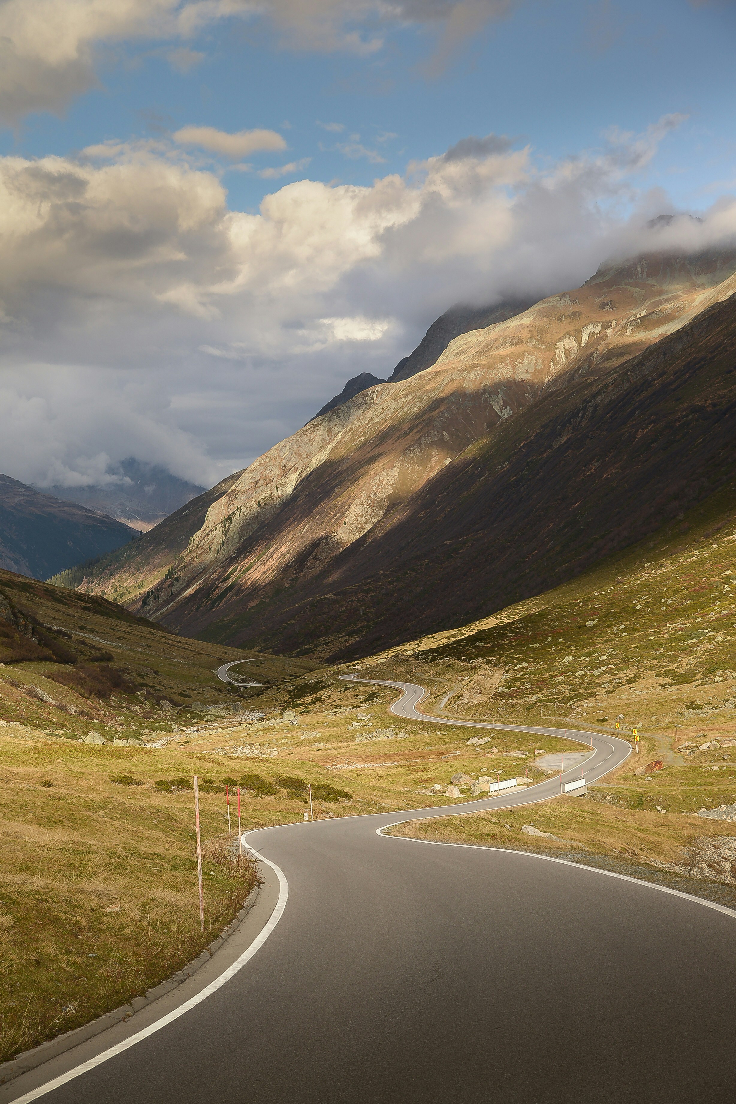 A winding road in the middle of a mountain range