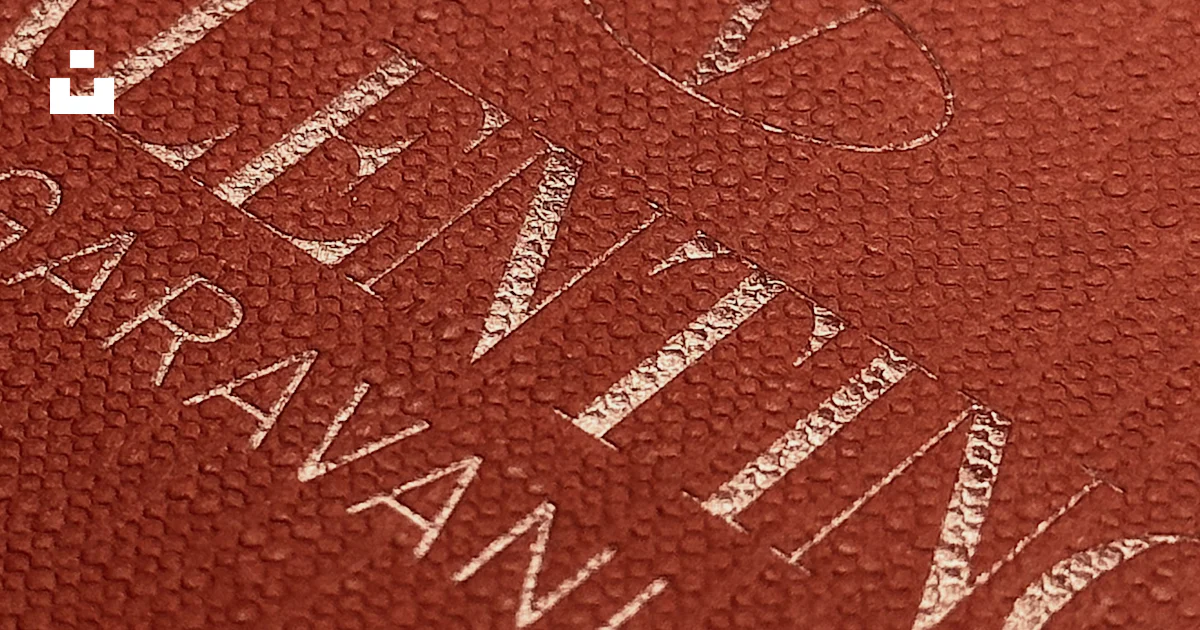 A close up of a red book with white lettering photo – Free Texture ...