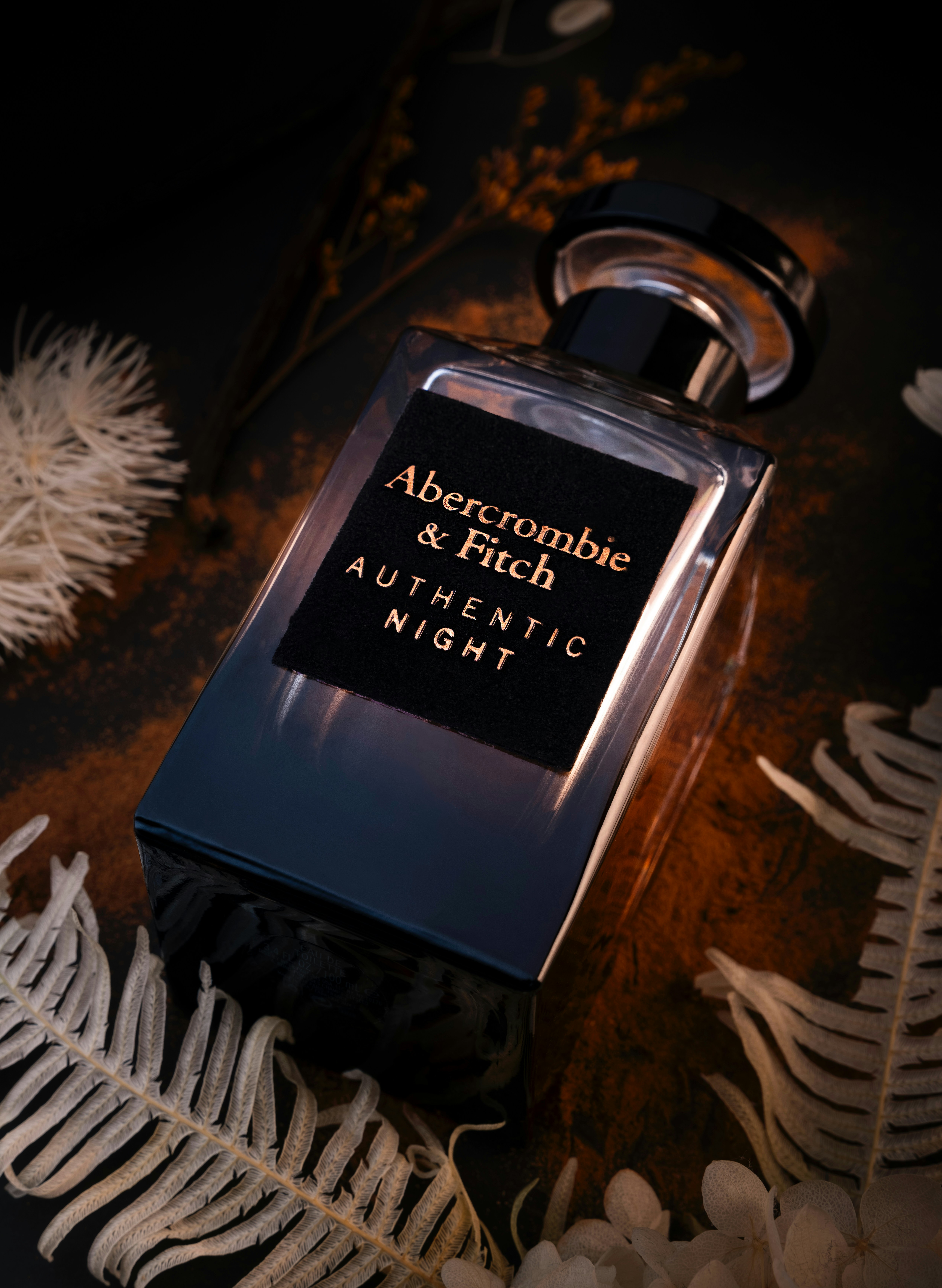 A bottle of perfume sitting on top of a table