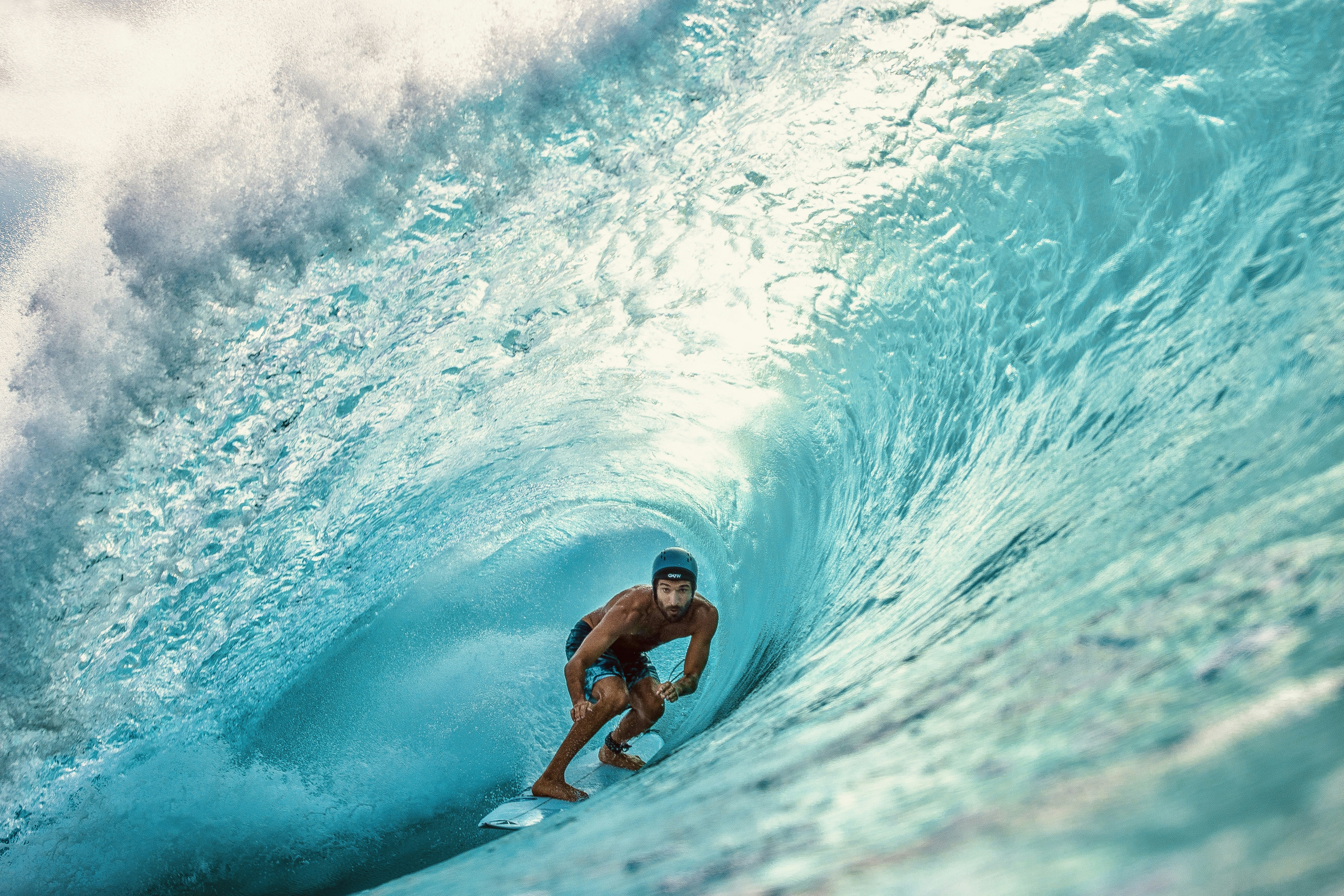 A man riding a wave on top of a surfboard photo – Free Man Image on ...