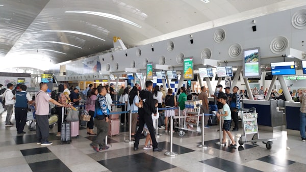 Long line of travelers waiting at an airport border control area