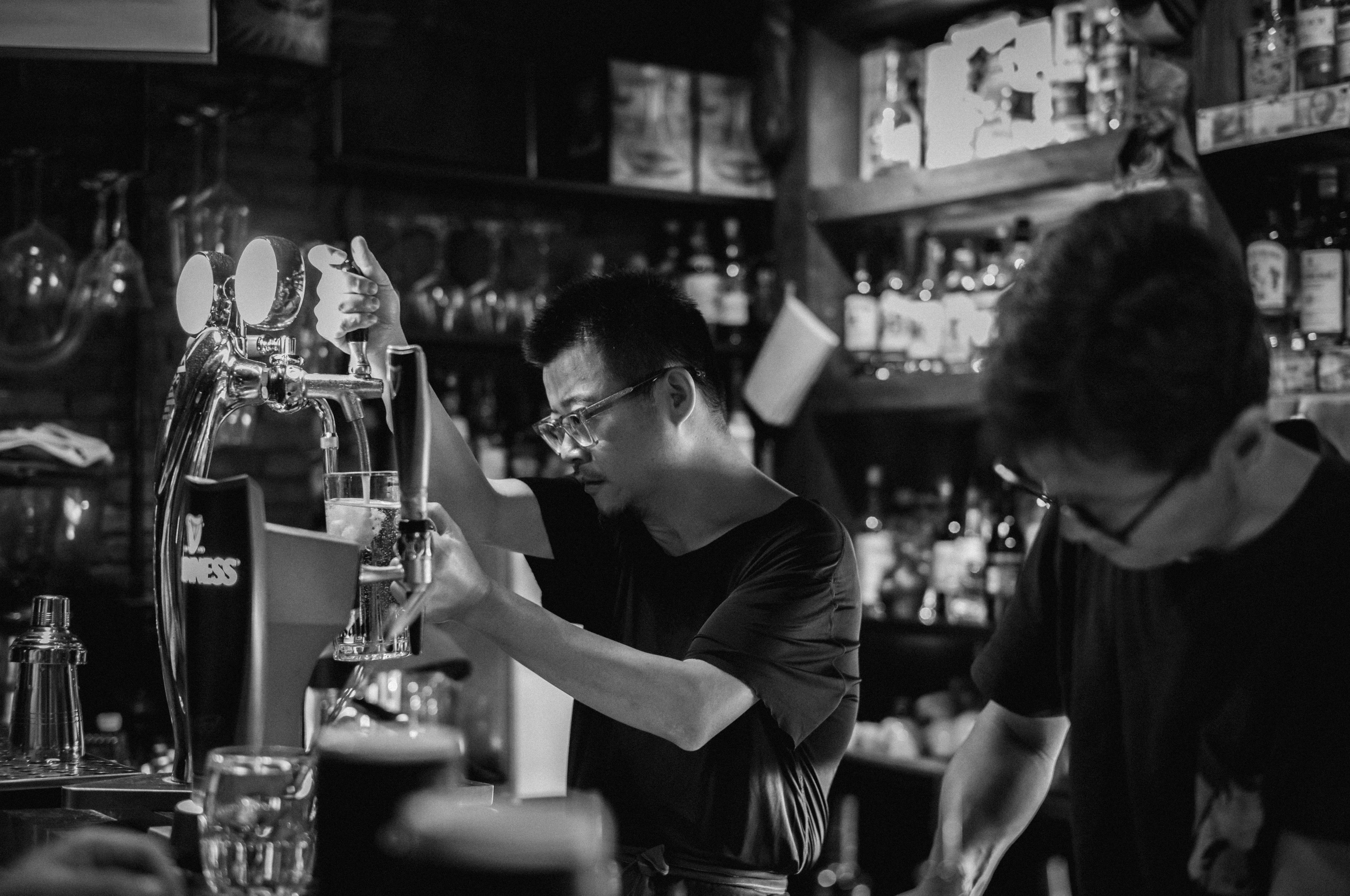 A couple of people that are at a bar