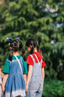 Two little girls standing next to each other