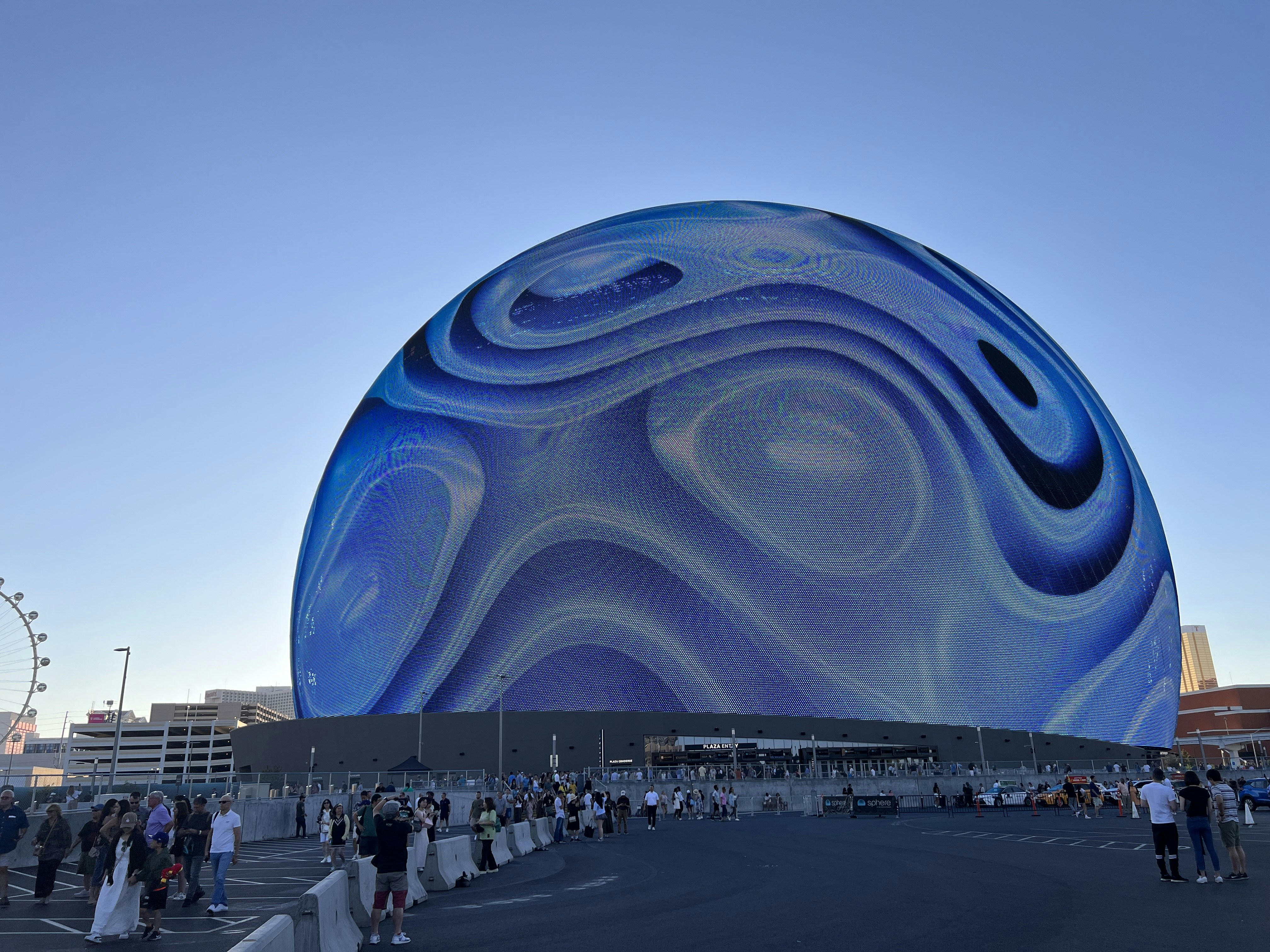 A large blue object sitting in the middle of a parking lot