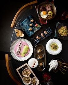A table topped with lots of different types of food