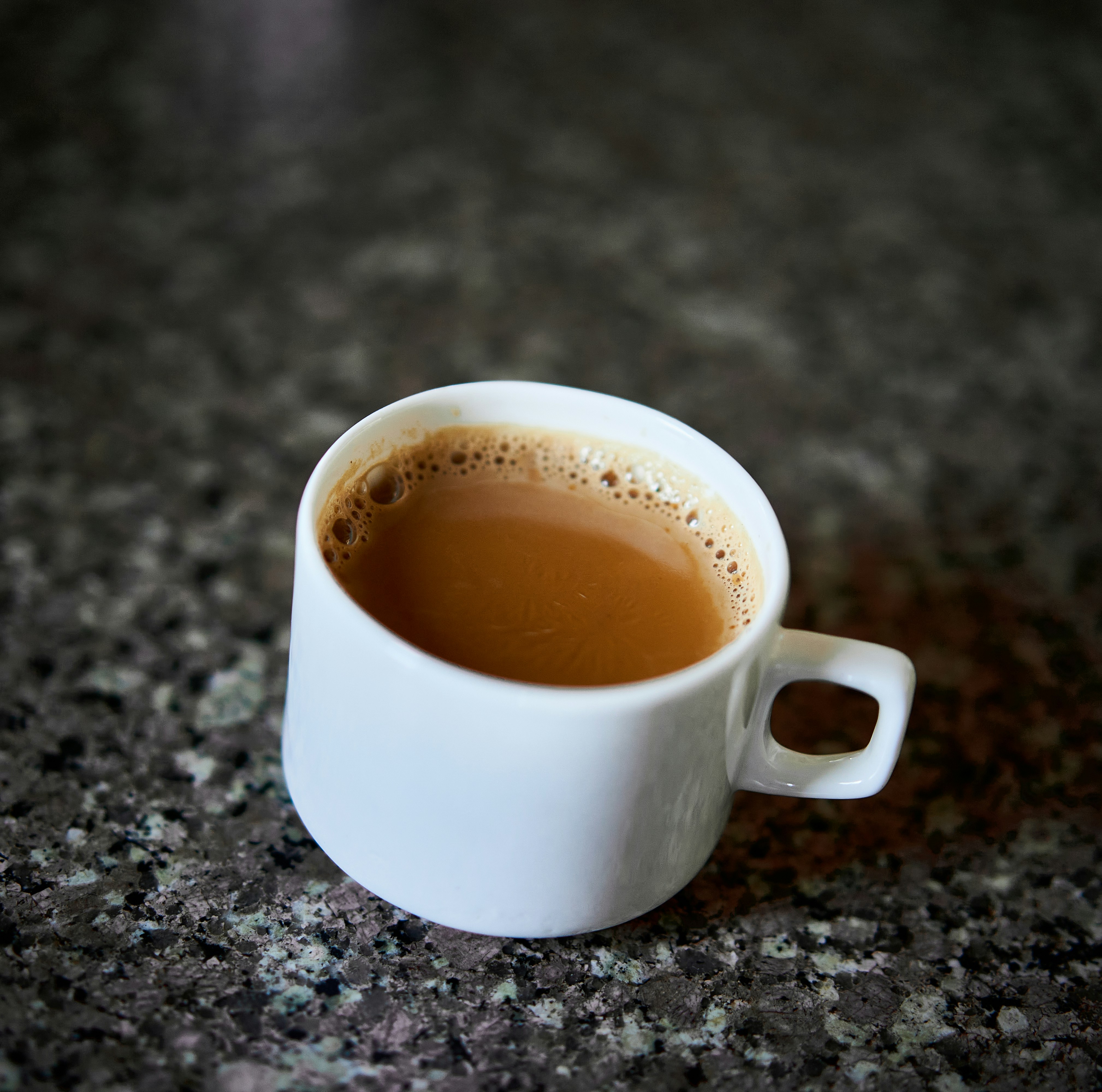 A cup of coffee sitting on top of a table