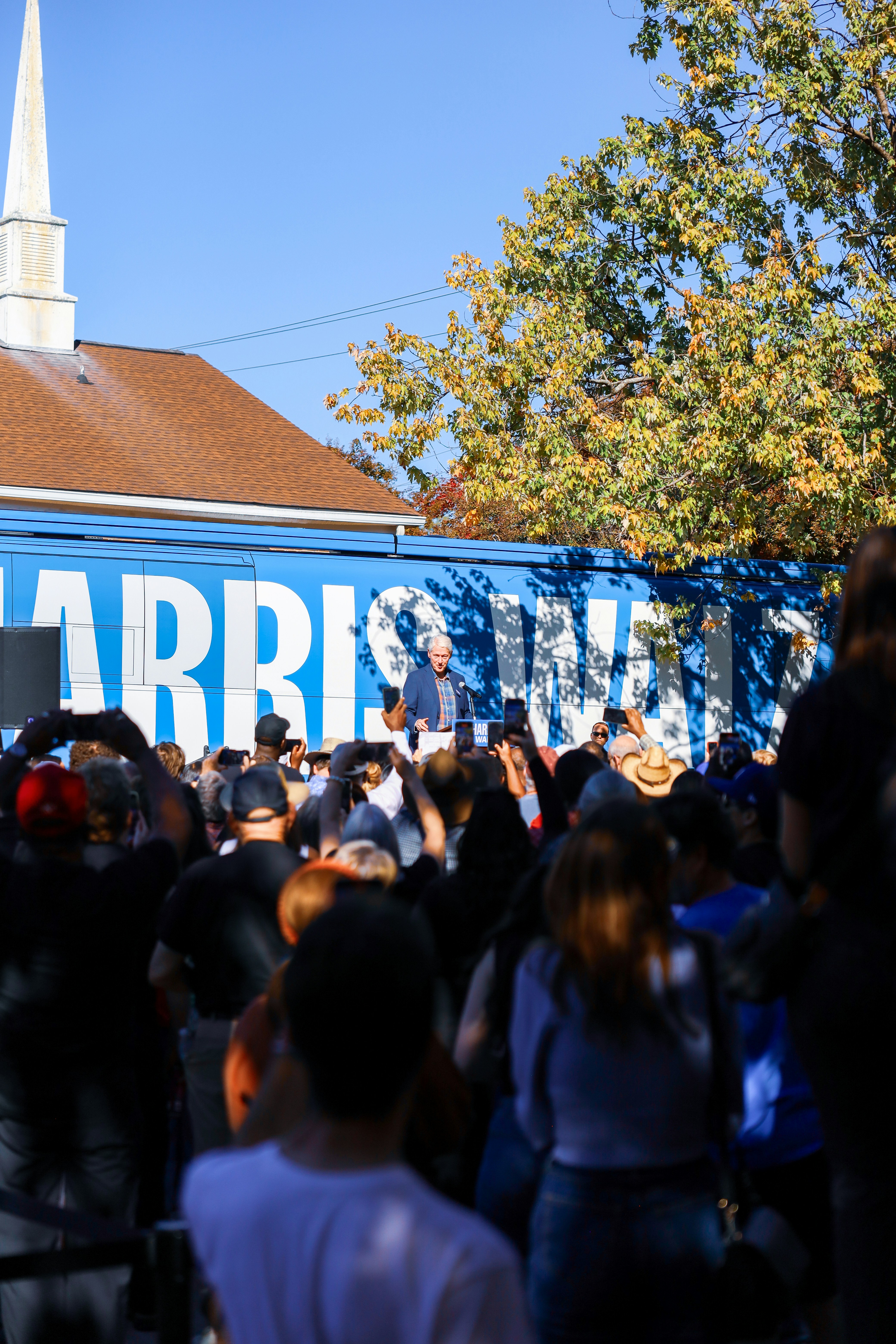 A crowd of people standing in front of a church