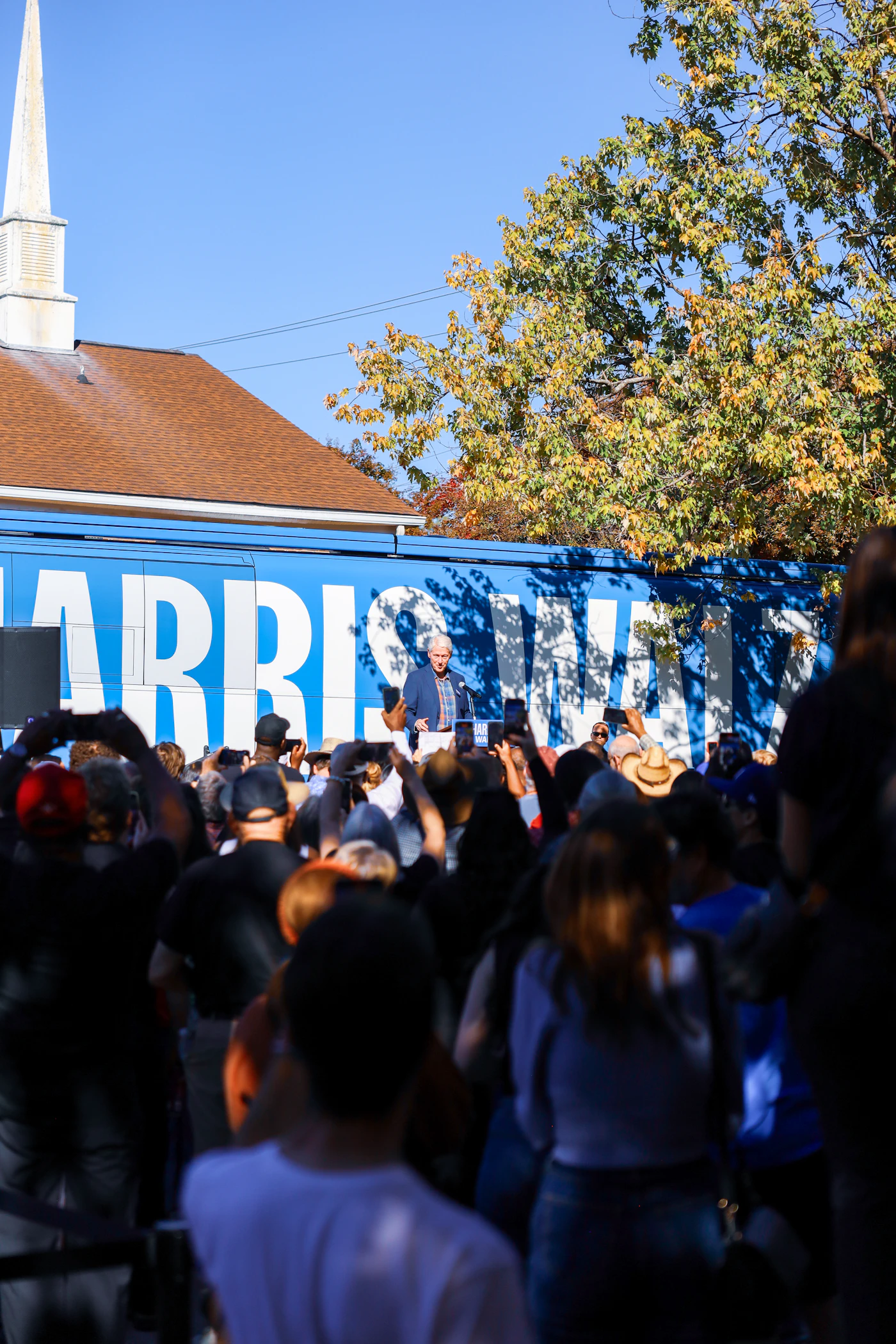 Campaign supporters gathered at a political rally — the kind of voter audience reached through political SMS marketing