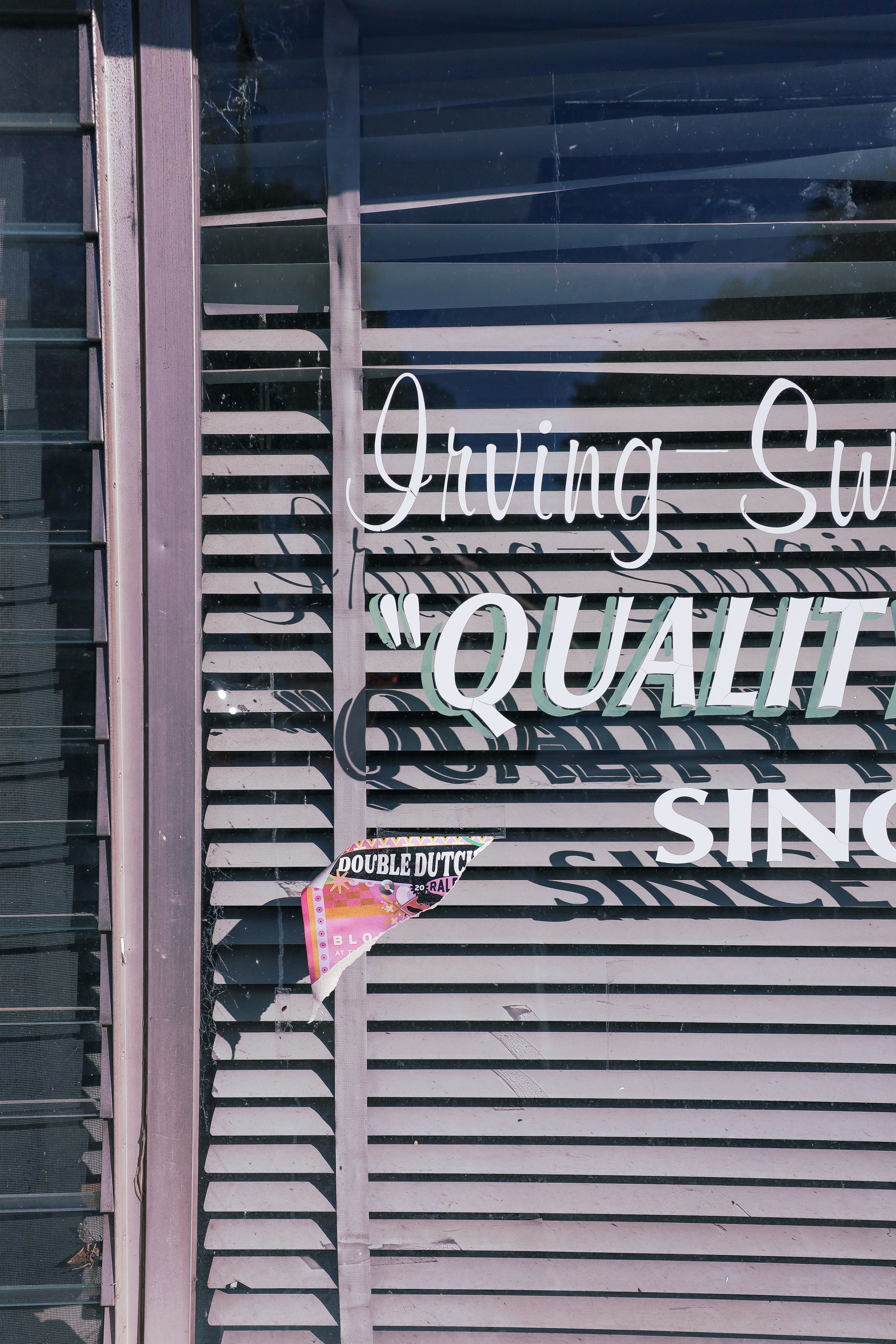 A store front with a sign on it