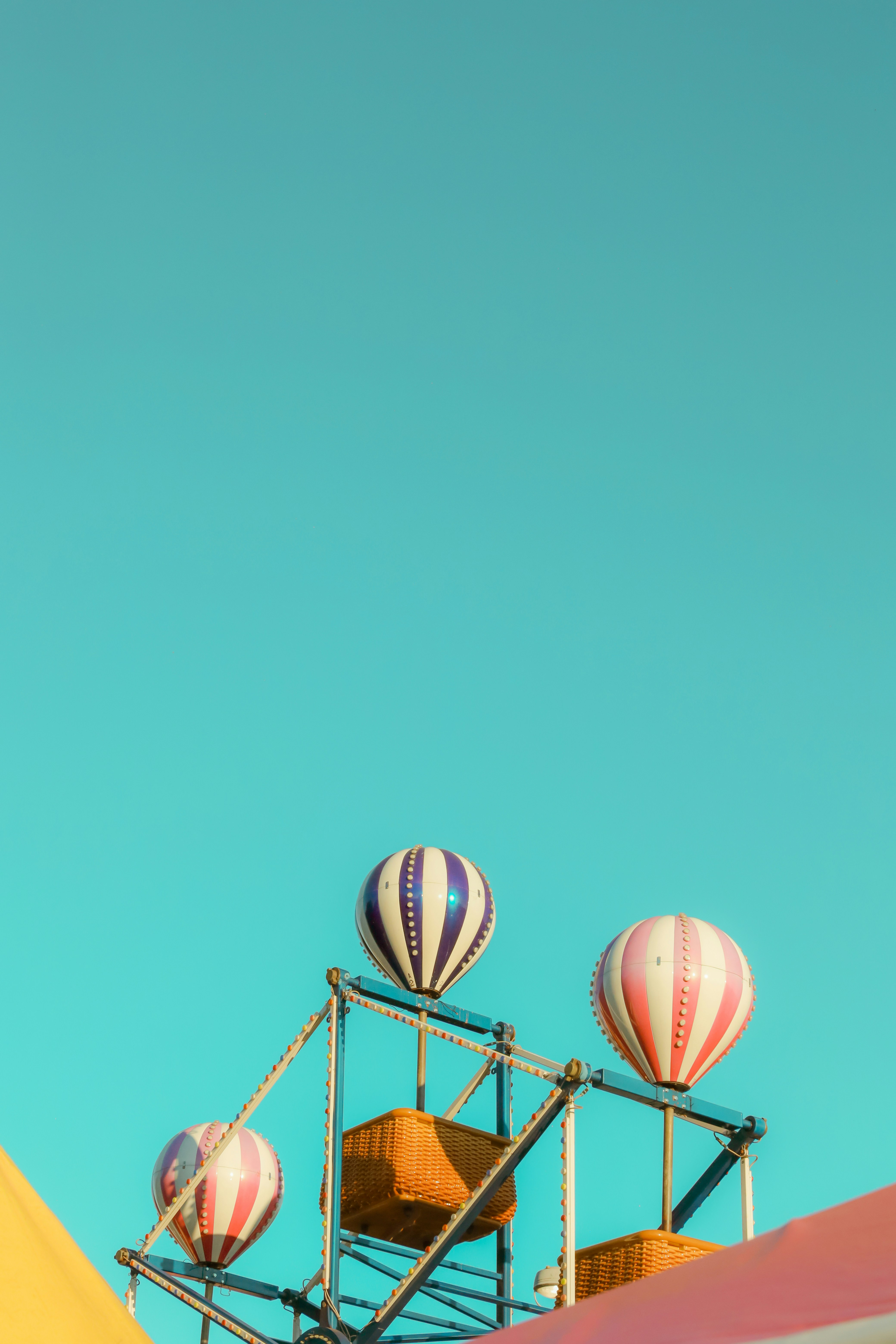A group of hot air balloons sitting on top of a building