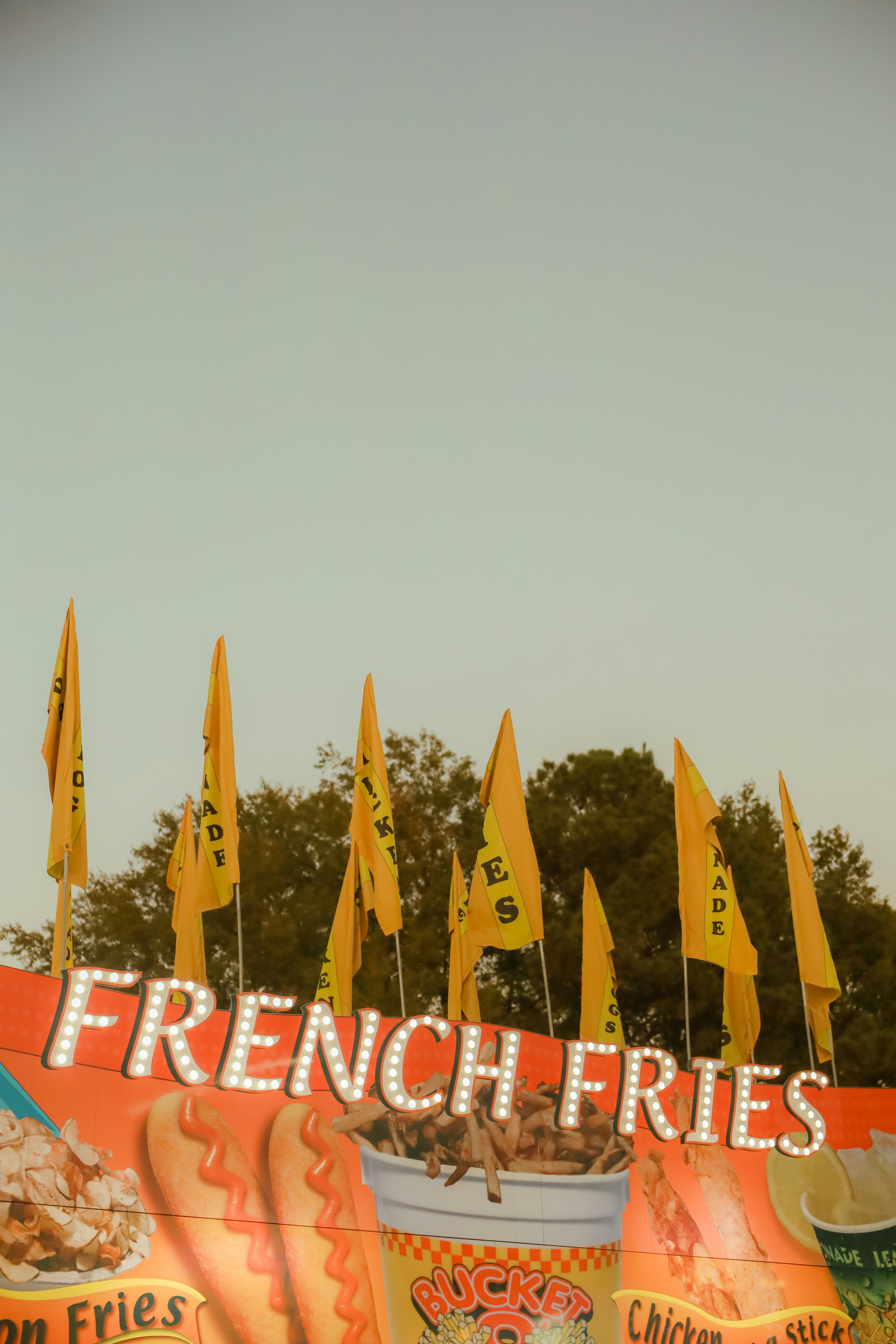A large sign that says french fries on the side of a building