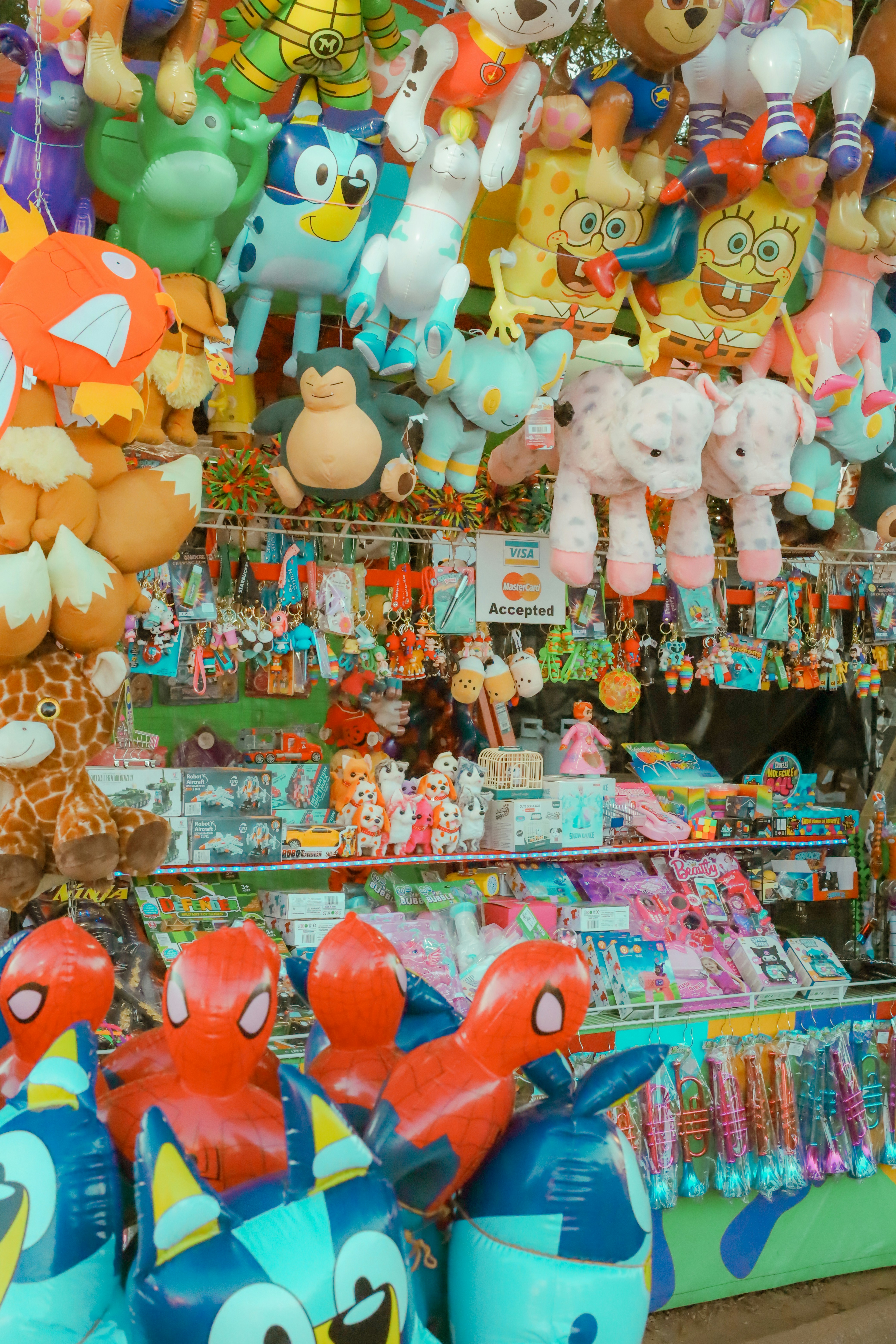 A bunch of stuffed animals on display in a store