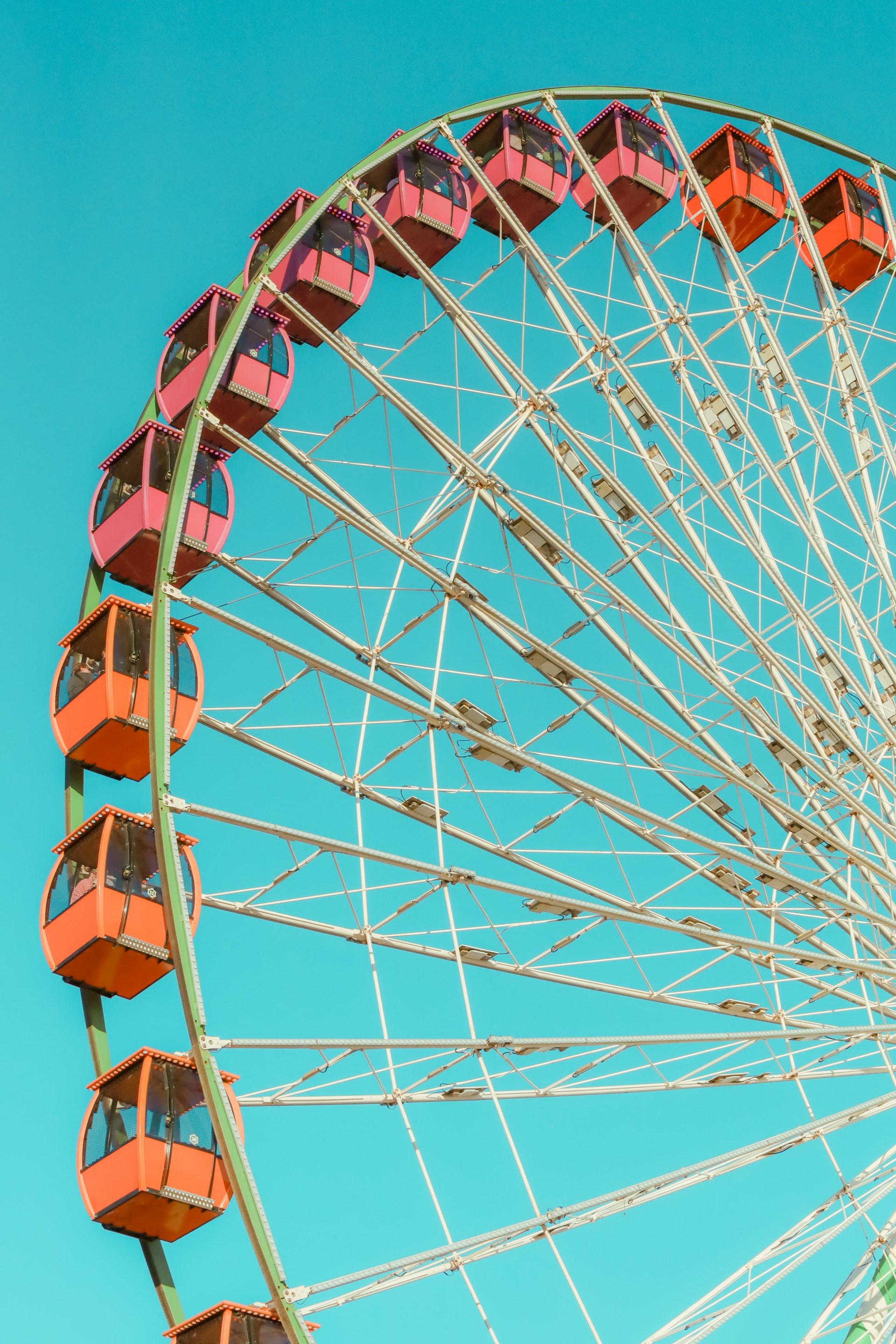 A ferris wheel with a blue sky in the background