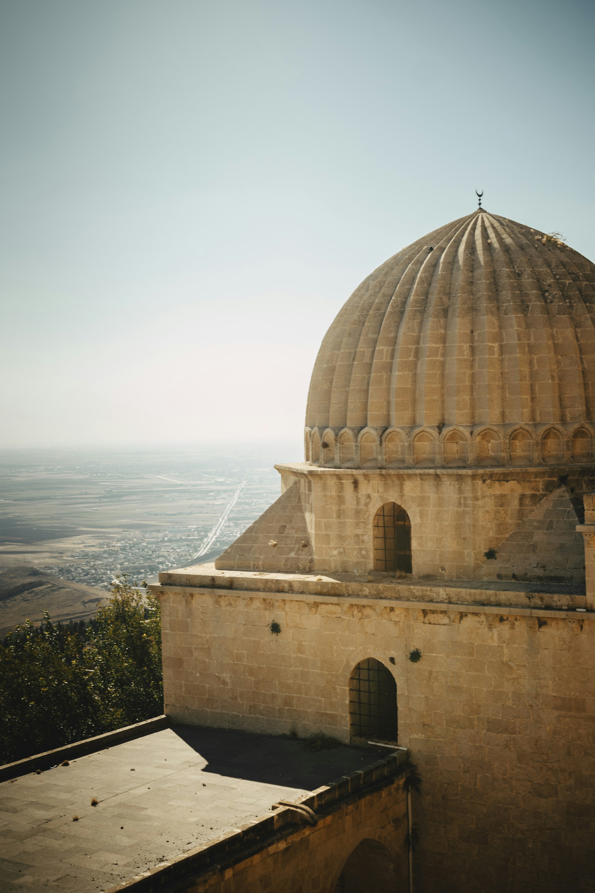 A dome on top of a building with a view of a valley