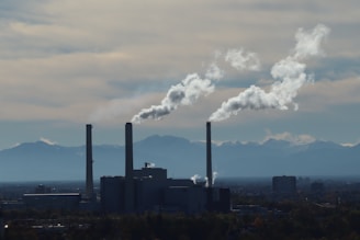 A factory with smoke coming out of it's stacks