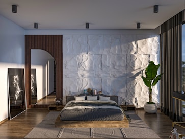 A bedroom with a large bed and a large window