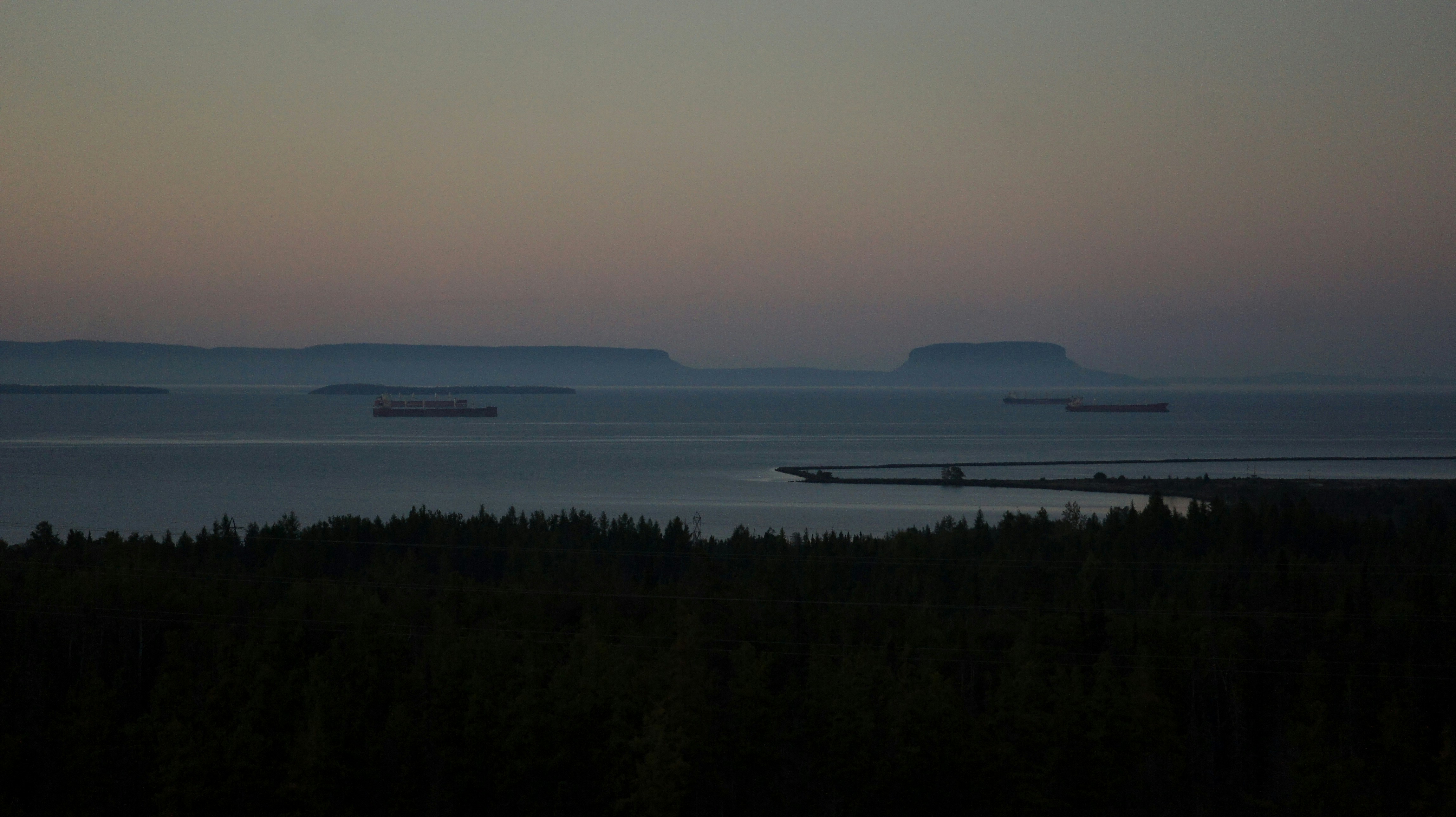 A plane flying over a body of water