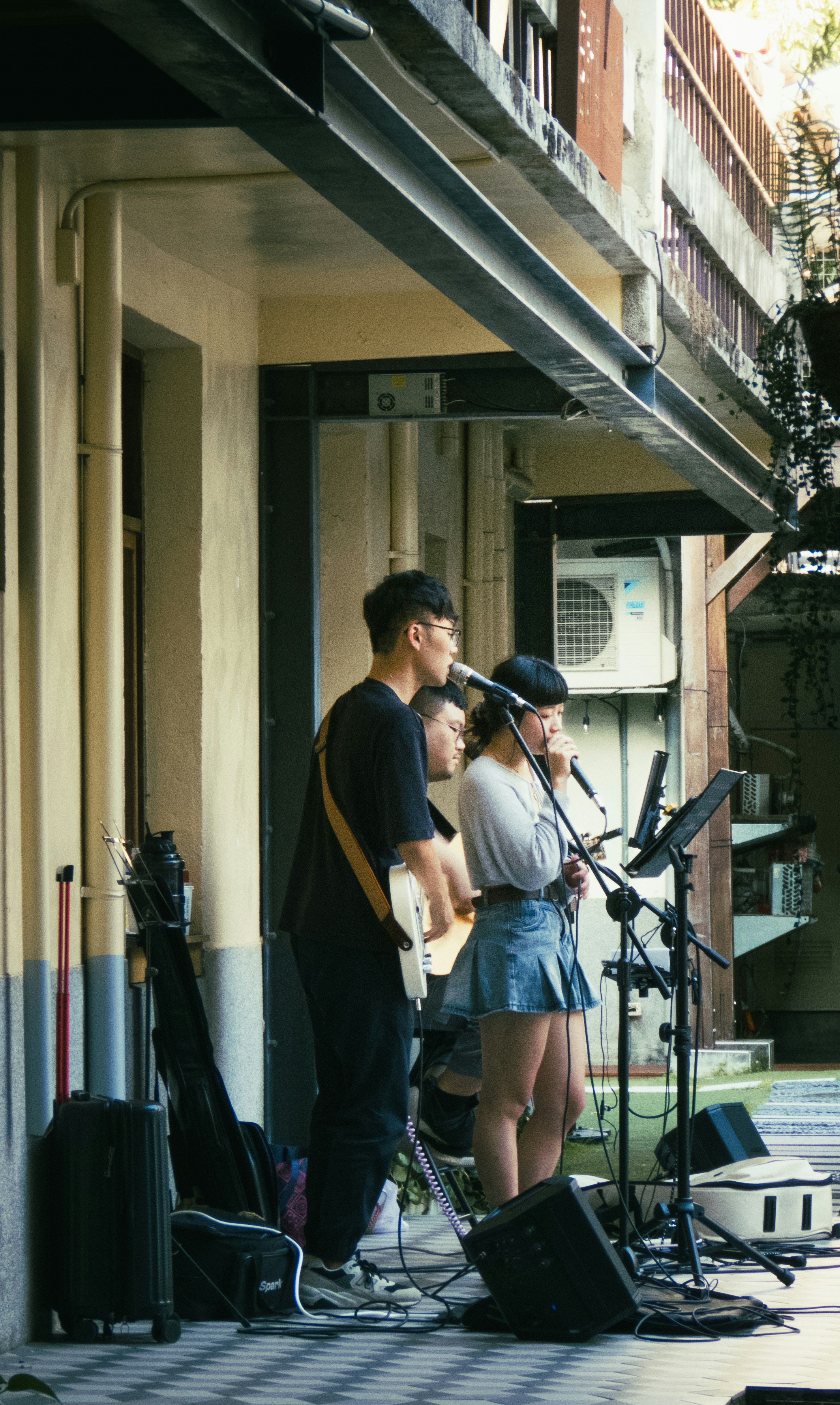 A group of people that are standing in front of a microphone