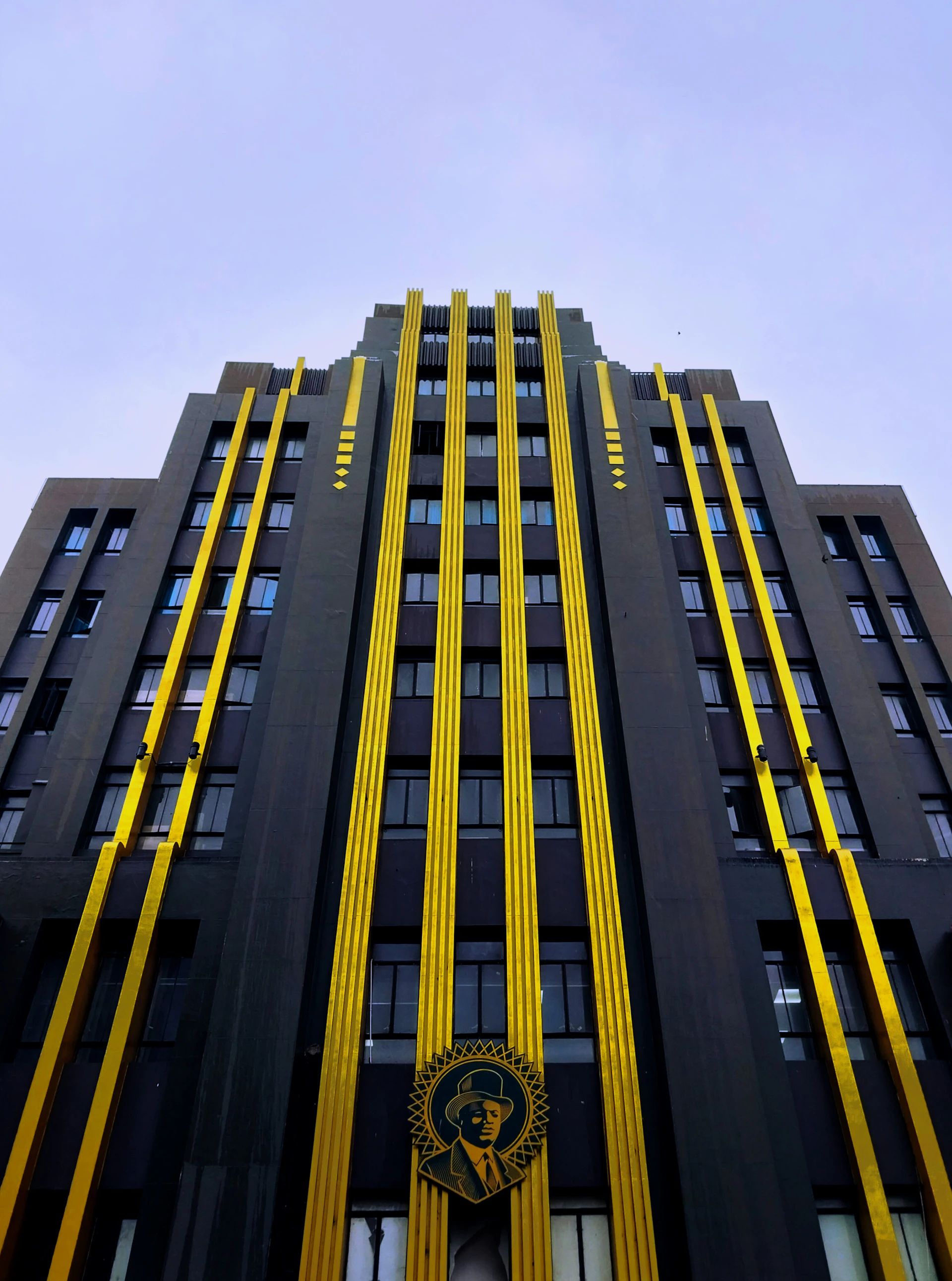 A very tall building with a clock on it's side
