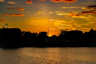 The sun is setting over a body of water