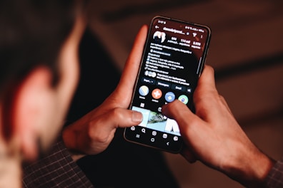 A man holding a cell phone up to his face