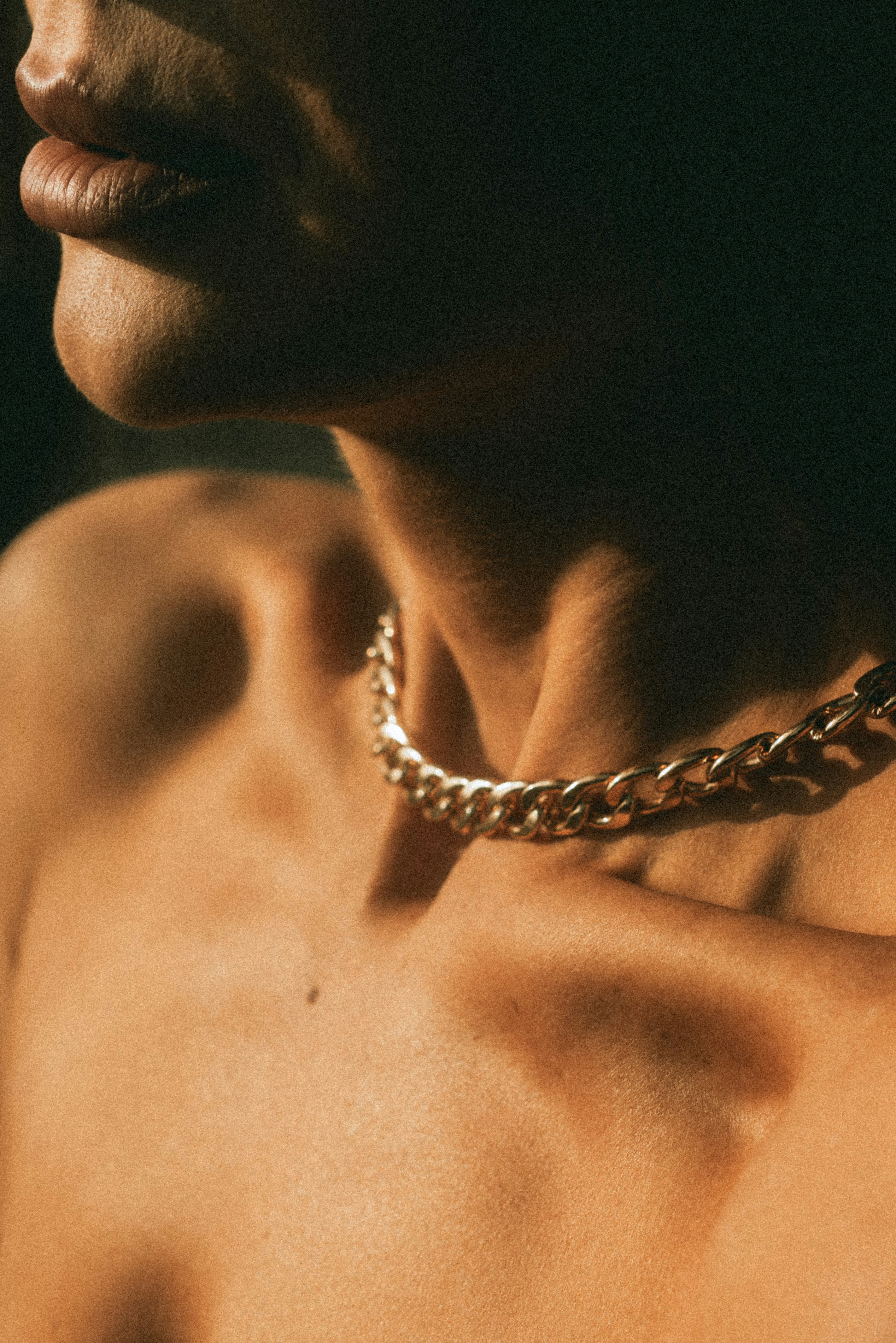 A close up of a person wearing a necklace