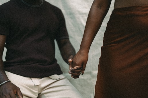 A man and a woman holding hands