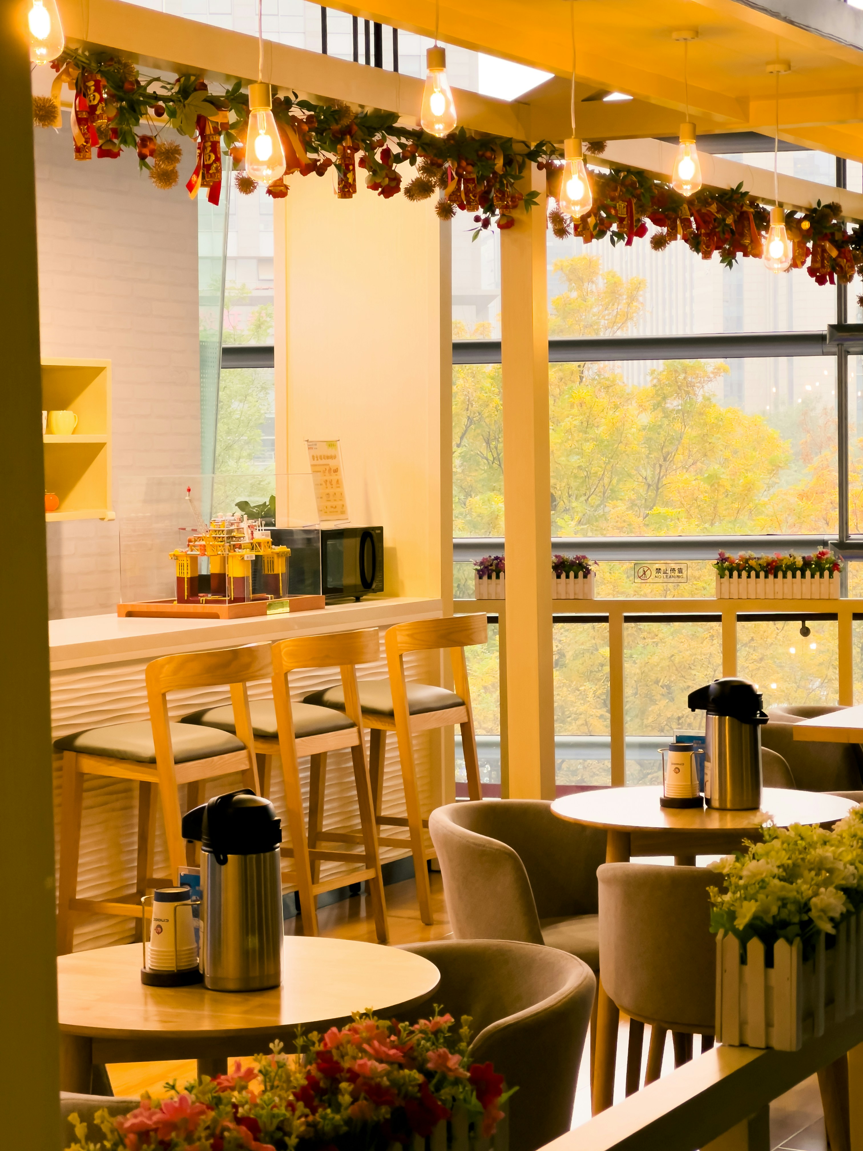 A restaurant with tables, chairs, and a bar