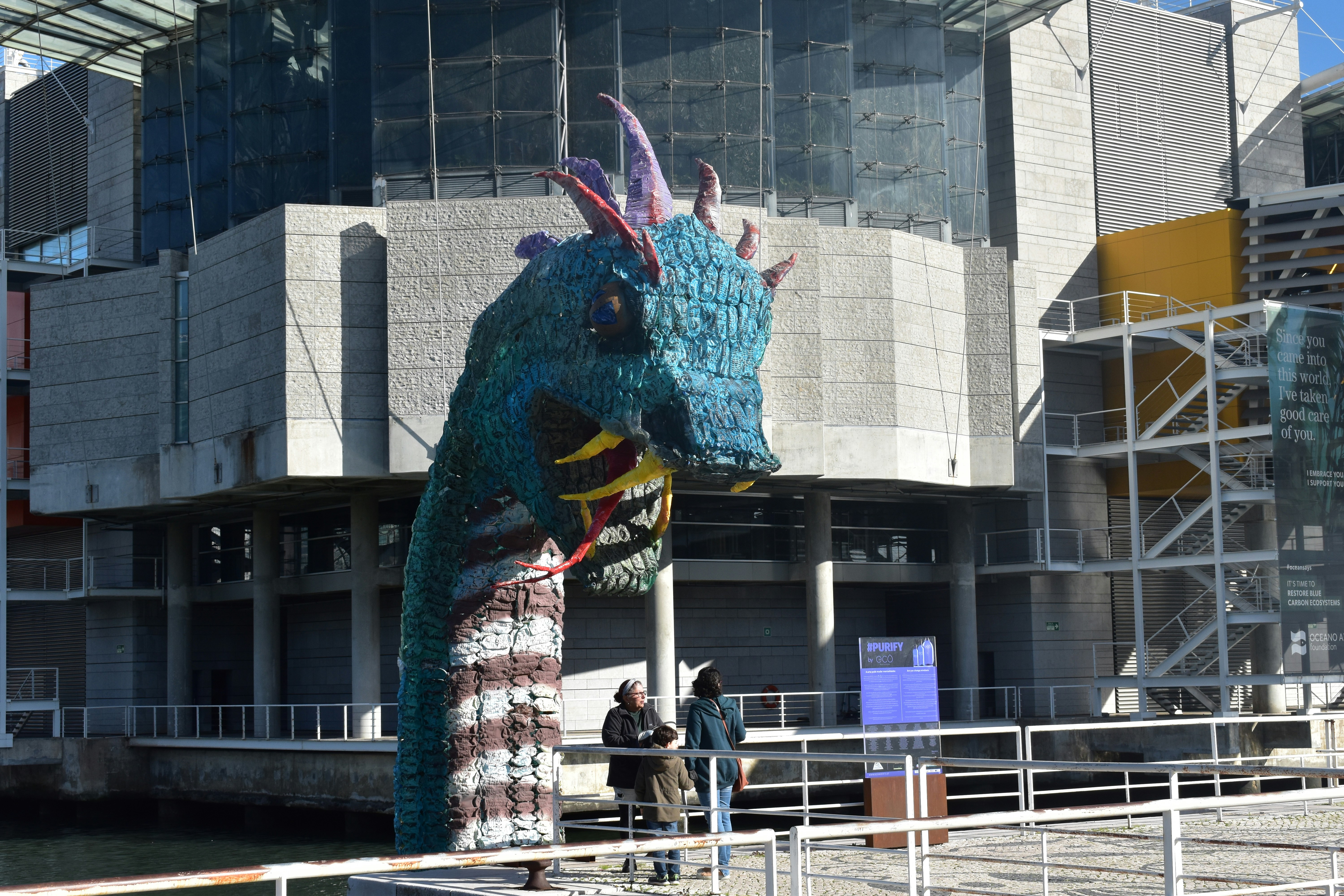 A statue of a dragon in front of a building photo – Free Travel Image ...