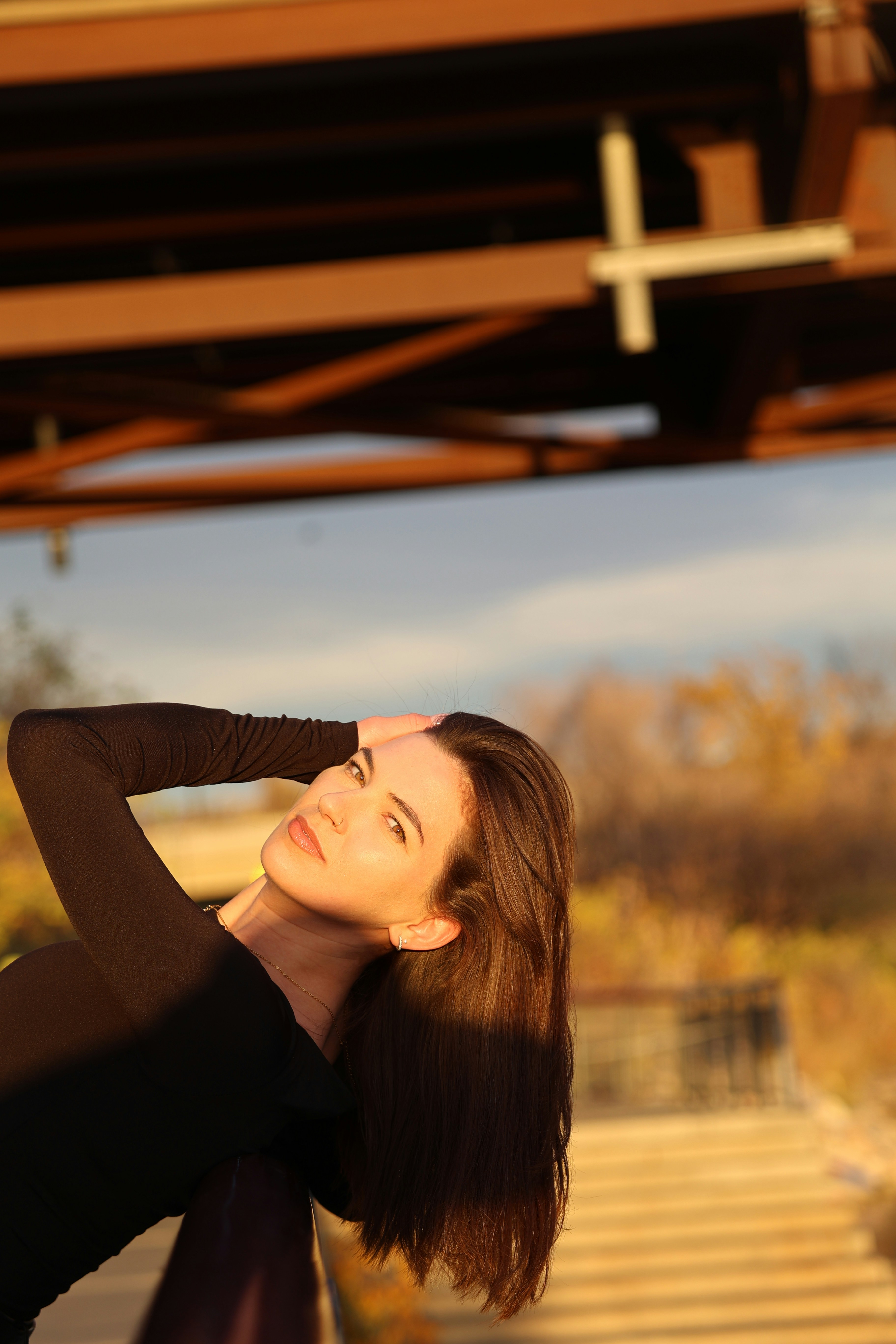 A woman in a black dress posing for a picture