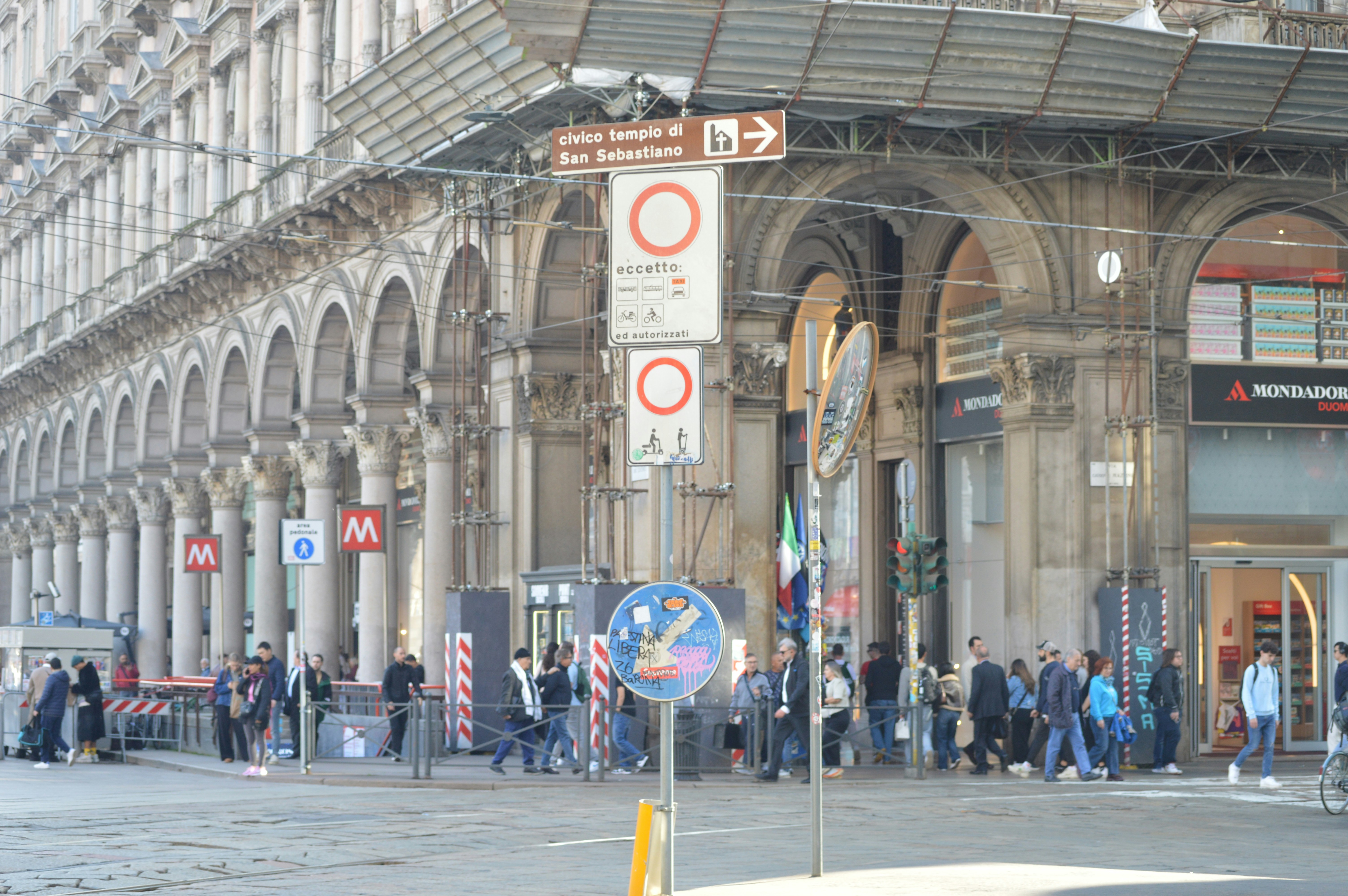 A group of people standing outside of a building